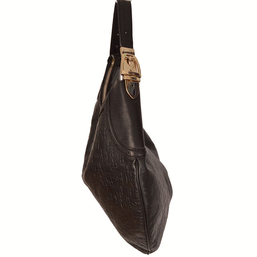 Gucci black horse bit hobo bag with embossed horse bit pattern
- Silver hardware
- Interior zip pocket, canvas lining
- Measurements: Height: 12