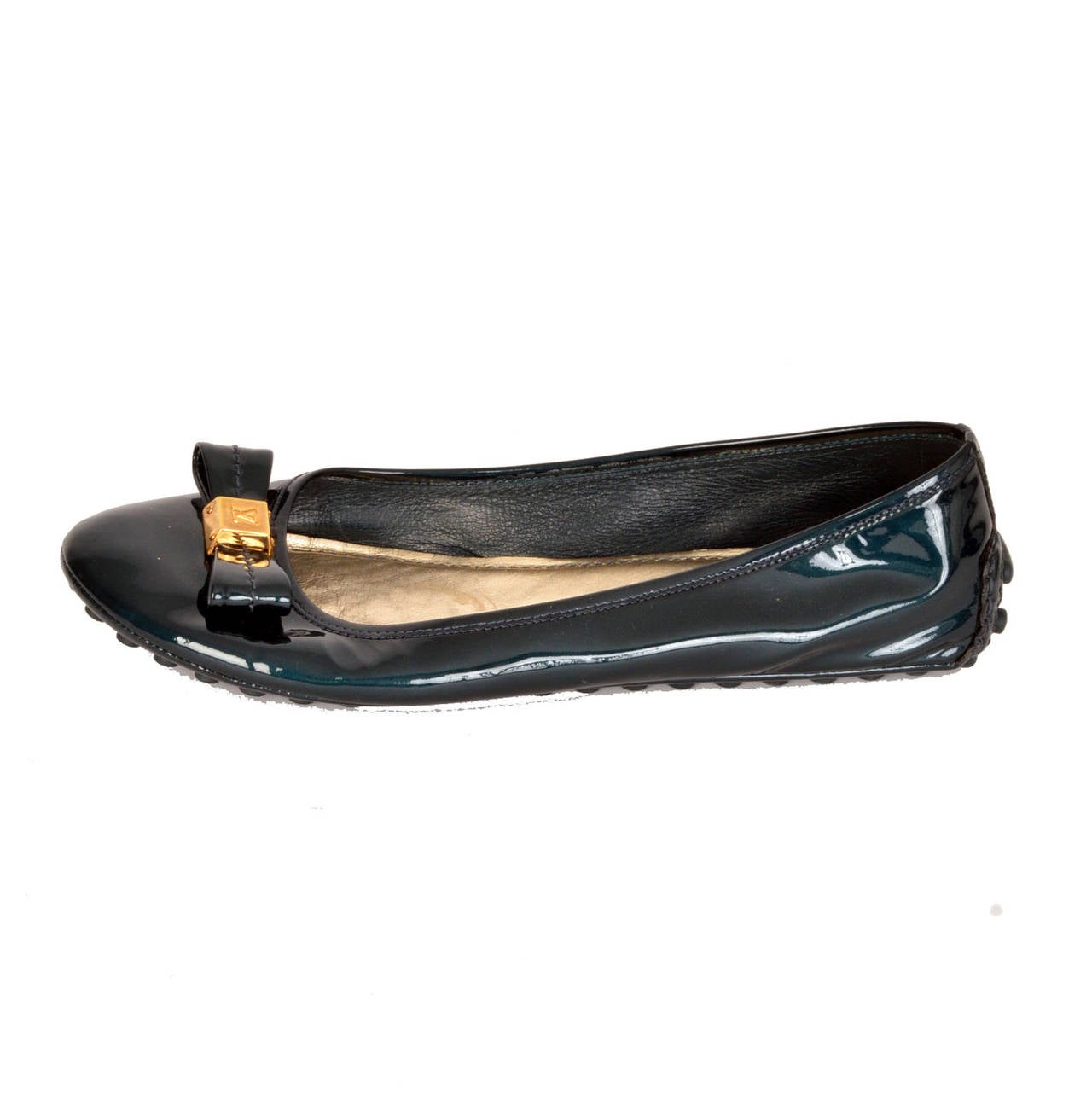 Louis Vuitton iridescent blue flats with bow 
Gold LV symbol on bow and Louis Vuitton label on back, textured bottom
- Condition: Like new, scratches on insoles
- Made in Italy
- Size 40