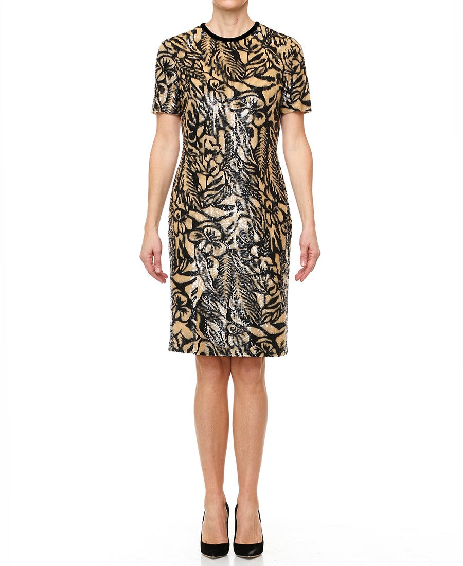 A stunning beige and black sequin fitted dress by Bill Blass. Features a round neck trimmed in thin black velvet and short sleeves. Tiny sequins in beige and black arrange in a beautiful floral/leaf pattern.
- Fully lined in beige
- Back zip