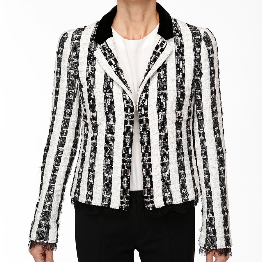 A spectacular cocktail jacket in bicolor black & white striped fantasy tweed with Lesage embroidery. Over 100 oblong multi-faceted swarovski crystal, over 250 mini crystals & beads with sequins, approx. 200 shiny black resins beads of different
