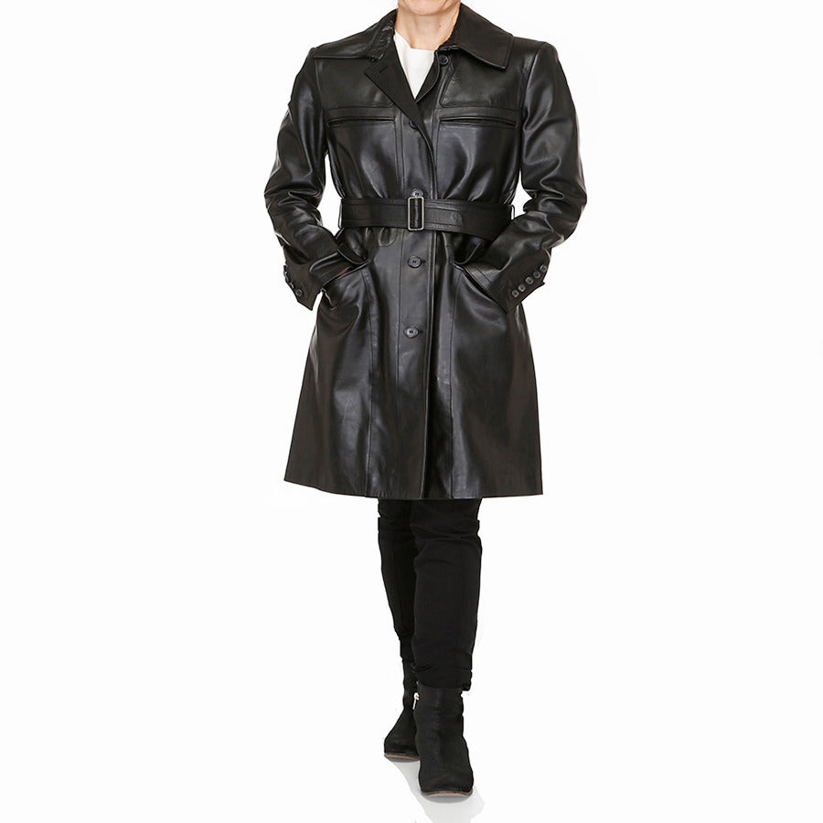 A stunning black leather trench coat by Calvin Klein. Designed by Calvin Klein during his last season before selling the company. This coat is such a classic and the leather gives it added flare and style. This is a great addition to any wardrobe -