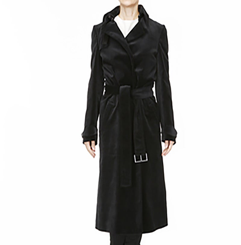A beautiful, rare and collectible coat from Tom Ford for Gucci. Tailored cut made from soft, black cotton velvet, it has all the classic details with a yoke, deep side pockets and fabric belt with pewter Gucci embossed buckle. Fastens with 2