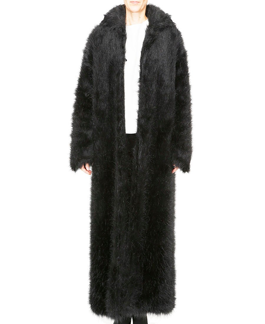 This incredible Chanel coat in black faux fur is what Karl Lagerfeld referred to as a “full length Polar Bear Coat”.  A simple silhouette with collar & 2 side pockets which may be worn open over winter knits and pants or closed with 4 buttons /