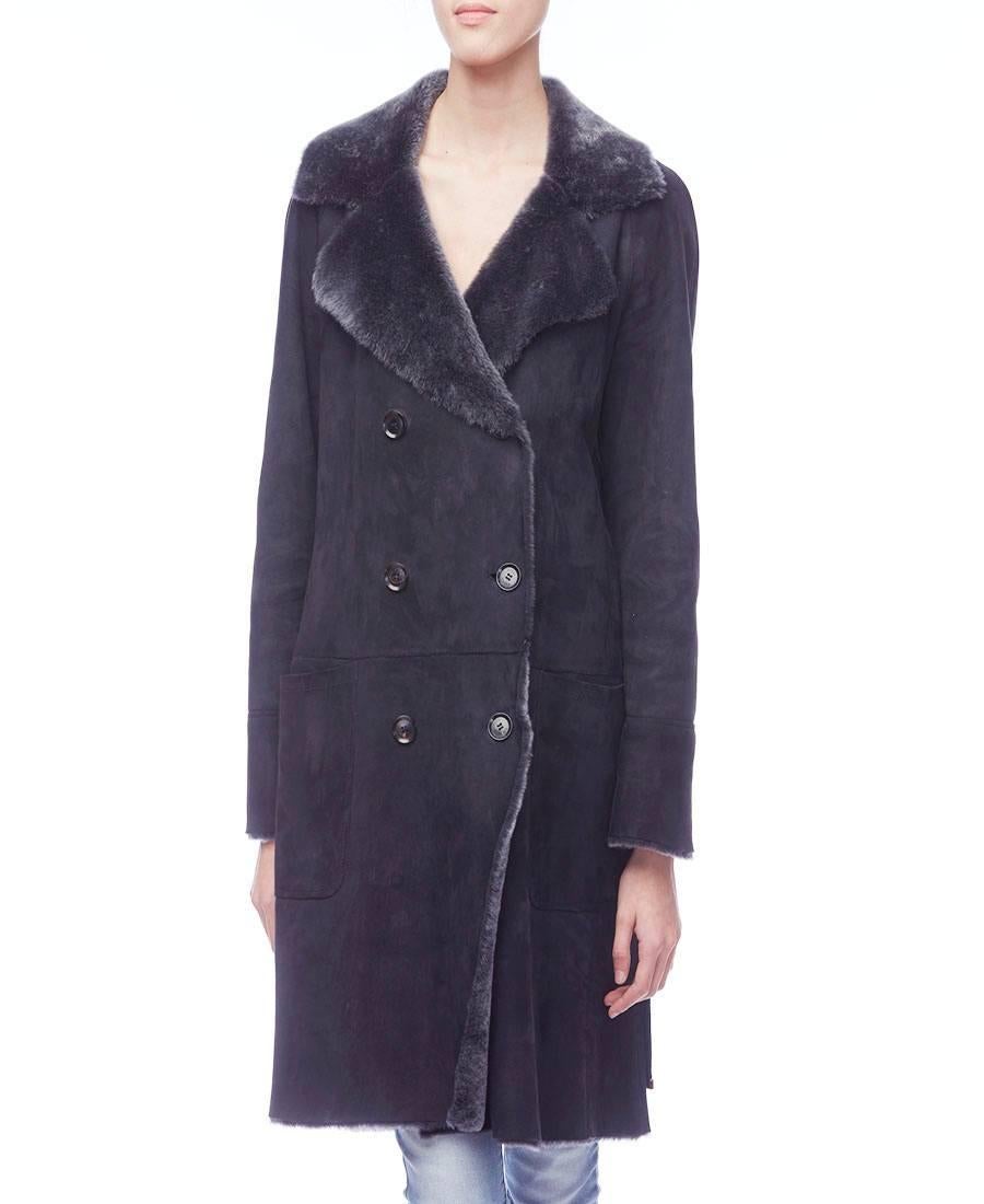 Stunning Gucci grey shearling fur double breasted coat. Dark grey shearling with blue undertones. This beautiful coat is lined in tonal grey shearling lamb fur and features two front open pockets, detachable belt, notched lapel collar. This