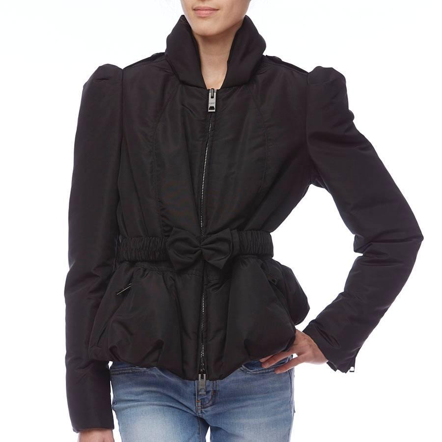 This chic puffer jacket by Burberry Prorsum features a voluminous bow secures the ruched elastic belt of an ultrafeminine jacket designed with puffed sleeves and a peplum waist.
- Approx retail price: $1950.00
- Front two-way zip closure
- Front
