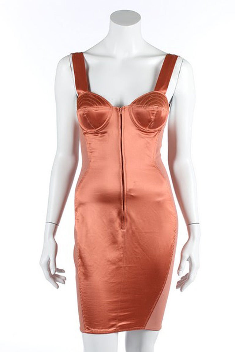 Fashioned of a copper viscose cotton and polymide with rubber elasticized panels allowing for side stretch. Front zipper closure and corset lace up back. Bust cups have defined padded topstitching, the infamous Gaultier signature 