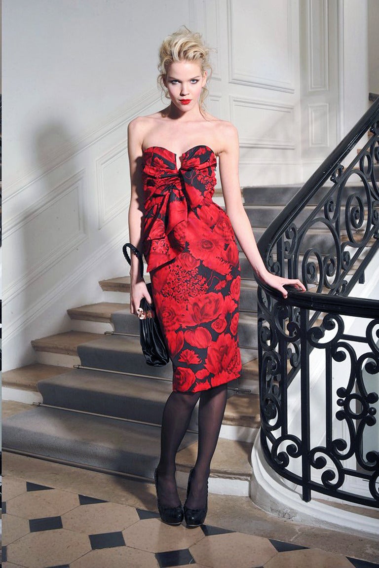An exceptional cocktail ensemble by John Galliano for the House of Dior pre-Fall 2009 collection.  Rare to see the dress with matching wrap together.  The floral motif and style of this runway piece strongly suggests the iconic dresses of Christian