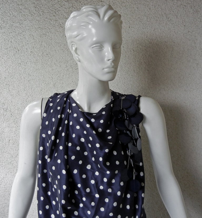 Lanvin fine silk navy blue and white polkadot print in a bias cut blouson silhouette.  Inspired by the elegant and haute couture fashion of the 1930's,  Lanvin's creative director, Alber Elbaz has created a design that is both elegant and edgy. 