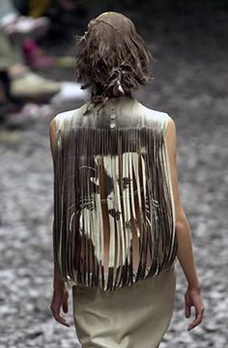A highly unusual, exotic wearable art lambskin leather dress from Alexander McQueen's 2000 African Yoruba Collection and as seen on the fashion runway.
 
Fashioned of buttery soft beige lambskin leather  and designed with a wonderful artistic