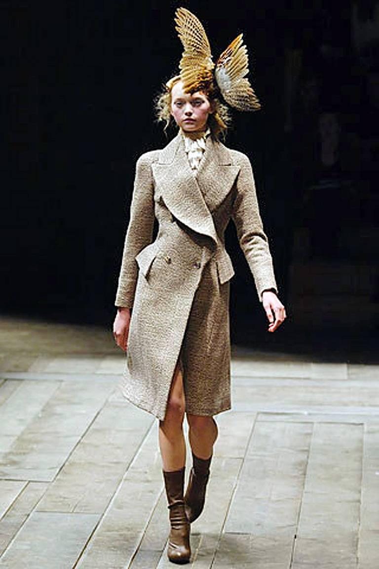 The Fall/Winter 2006 McQueen Collection draws some of its inspiration from the Scottish Highlands. The show also featured the designer's sharp, excellent tailoring a la great coats.   This fitted tweed coat (look # 2) is one of the best sharply