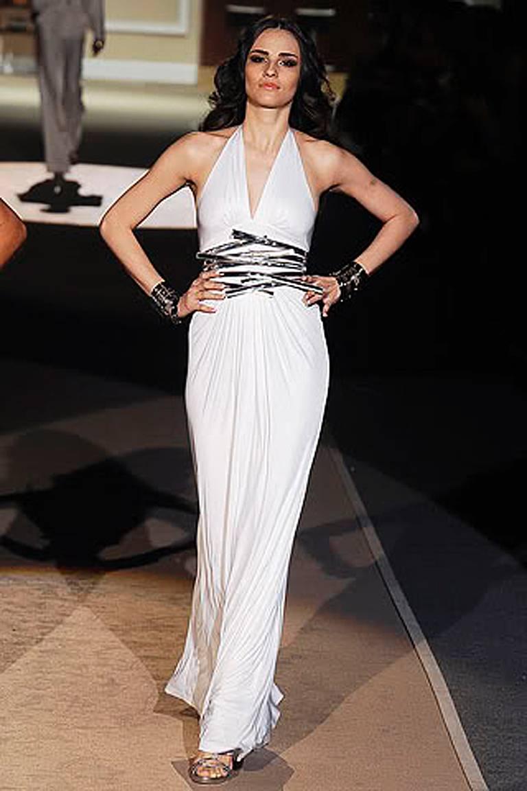 Dsquared2 stunning white jersey gown with plunging neckline and wide geometric pattern gold leather belt. Open back. Back zipper closure. 

Size: xs; bust: to 30