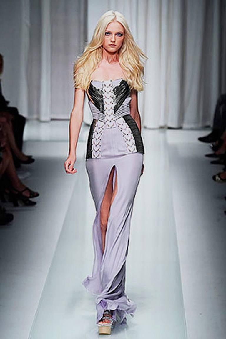 Versace strapless lavish lavender gown fashioned of 4-ply silk, softest lambskin leather and trimmed in silver metal. Corset interior. From the Versace Spring runway 2010 collection. Rare and hard-to-find.   See Donatella wearing the dress in photo.