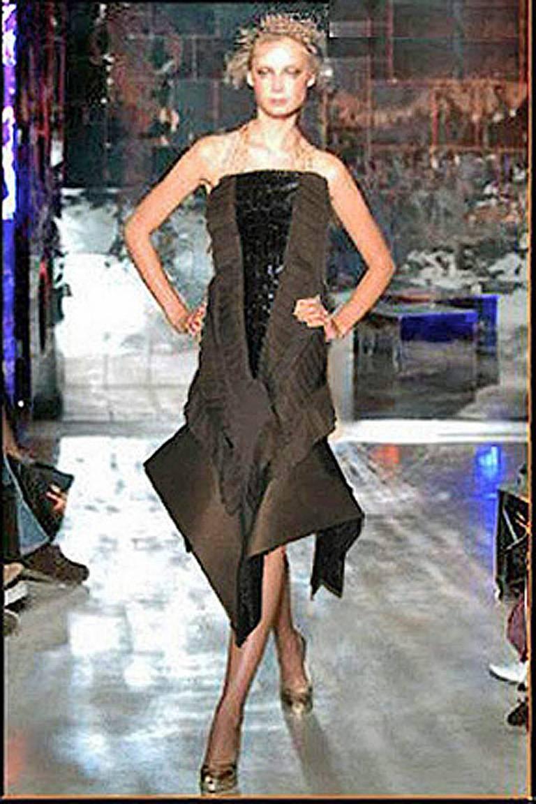 Over-the-top avant garde genuine croc, silk, organza and spandex dress by Gianfranco Ferre.  Offered brand new. 

Ferre's recent death leaves a legacy of magnificent artful and uniquely constructed high fashion eveningwear. Originally, having