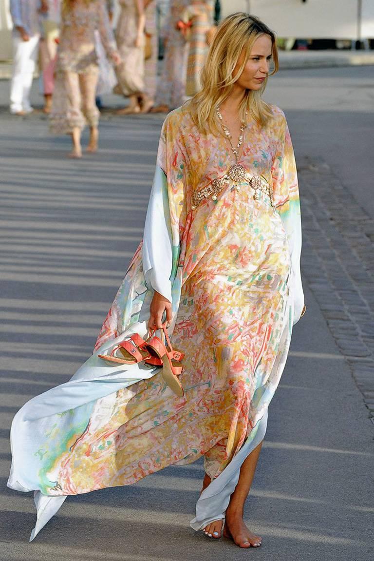 This Chanel caftan opens the 2011 Resort show with the backdrop flavor of the French Riviera.

Lightweight caftan fashioned of a silk and cotton blend in soft pastel color print with tie belt cinched at waist.  Ideal to wear paired with pants,