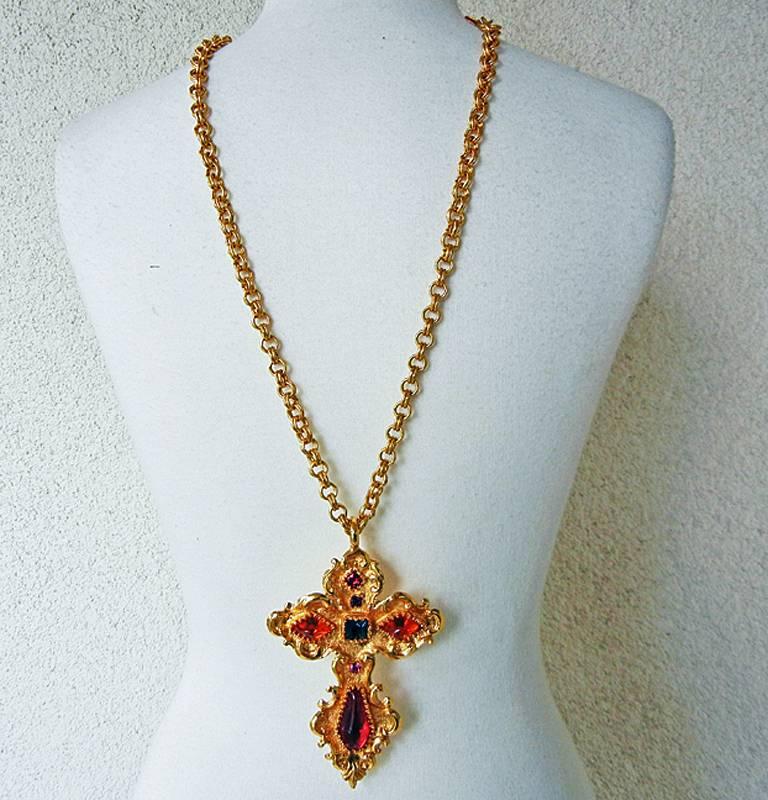 Christian Lacroix circa early 90's oversized baroque style cross in the designer's signature style.  Substantial and weighty with large jewels set in 18KT gold plate trimmed in fleur de lis design.  Weighty rolo chain.  Rare to find Lacroix's large