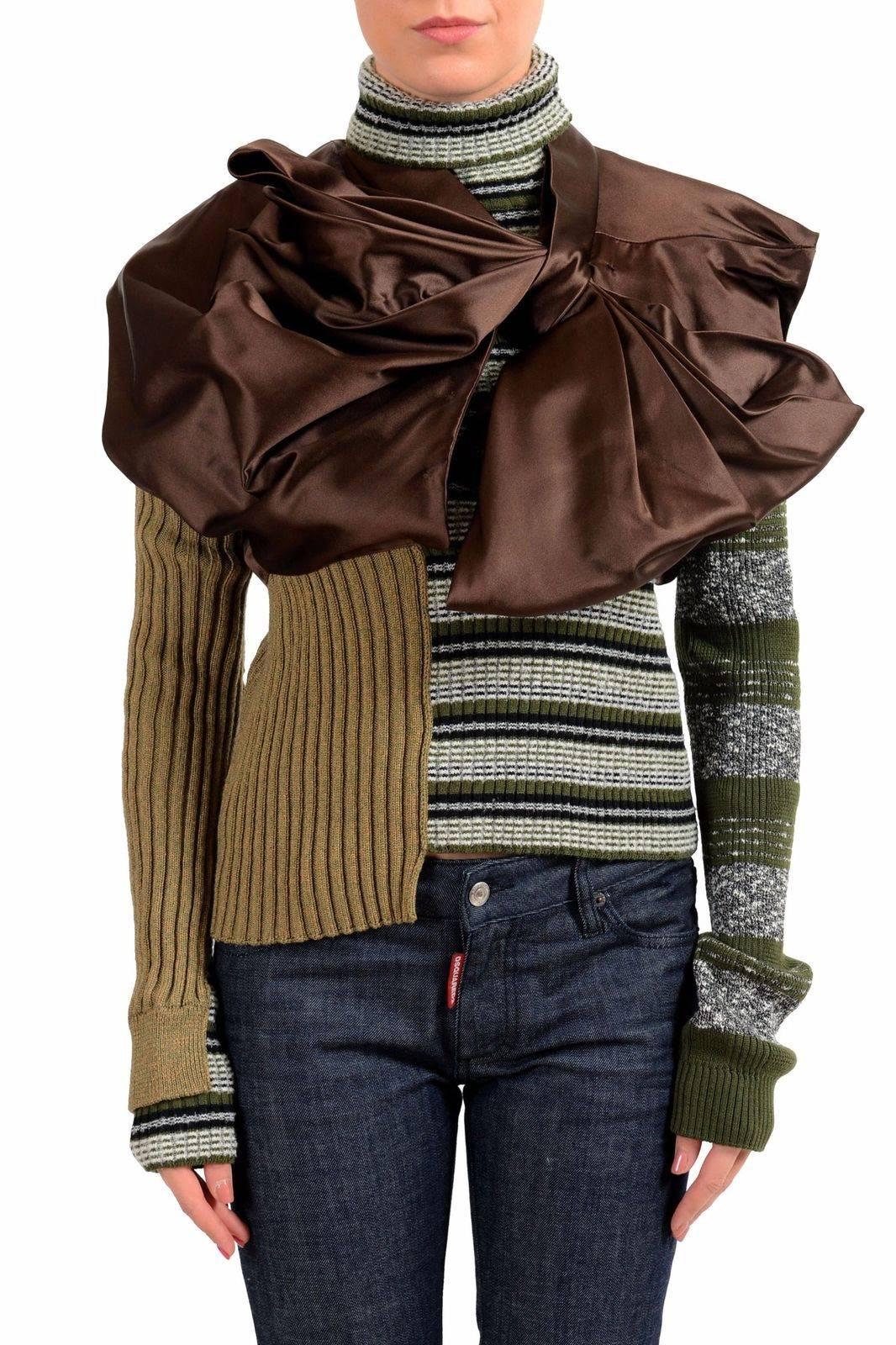 Stunning Masion Margiela mixed media asymmetric sweater adorned with large bow at shoulder.  As seen on the runway (see photo).
 
Fashioned of a soft wool, poly, viscose, and acrylic with all the marvelous fine Italian design and manufacture. 