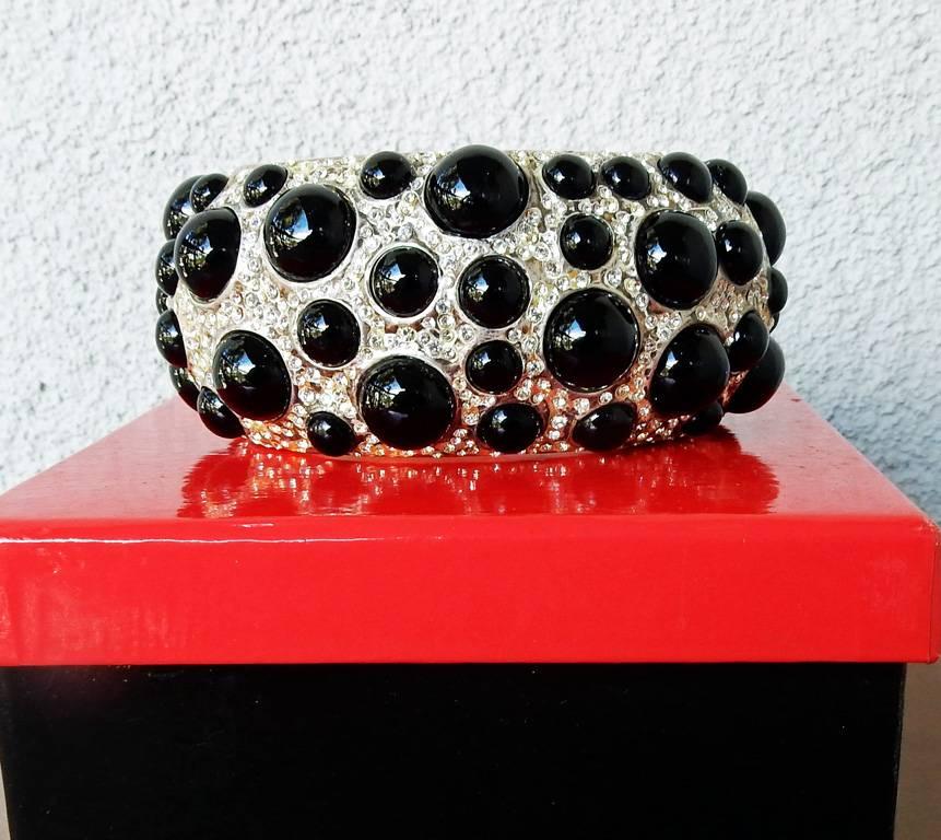 One-of-a-kind Valentino hand crafted haute couture cuff made for the 2001 S/S runway show (see photos of model wearing on each arm).  This bracelet is the actual one worn on the runway.  Oval shape is substantial and weighty constructed of