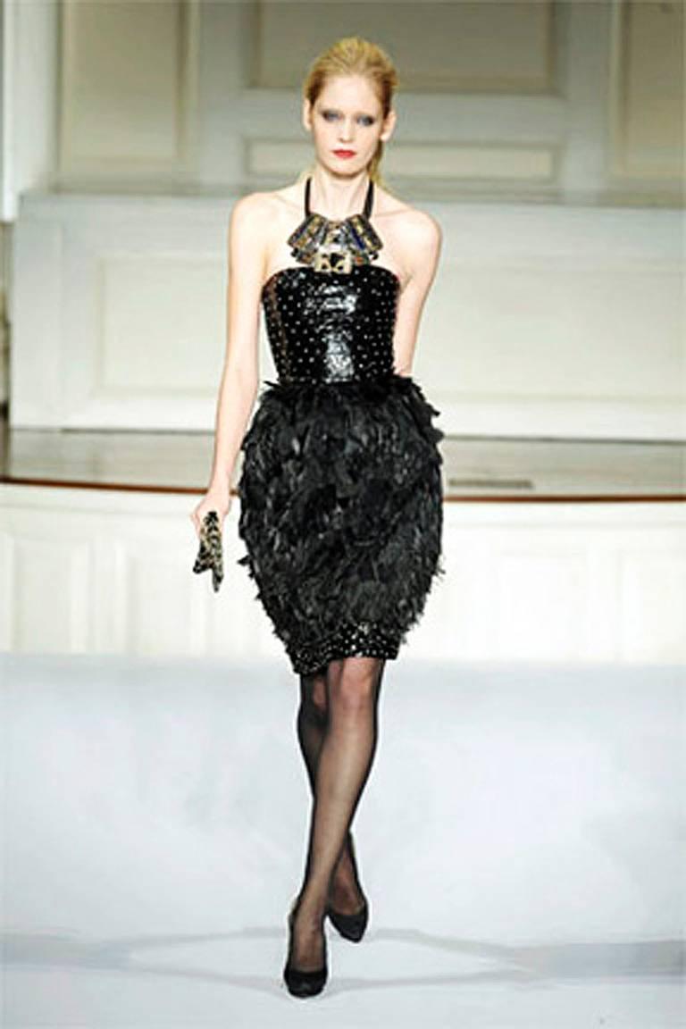 Oscar de la Renta's ready-to-party holiday dress. Offered brand new featuring genuine ostrich feather skirt.  Dress being offered is identical to that in the runway photos but does not include necklace. 

Dress has everything you could want for that