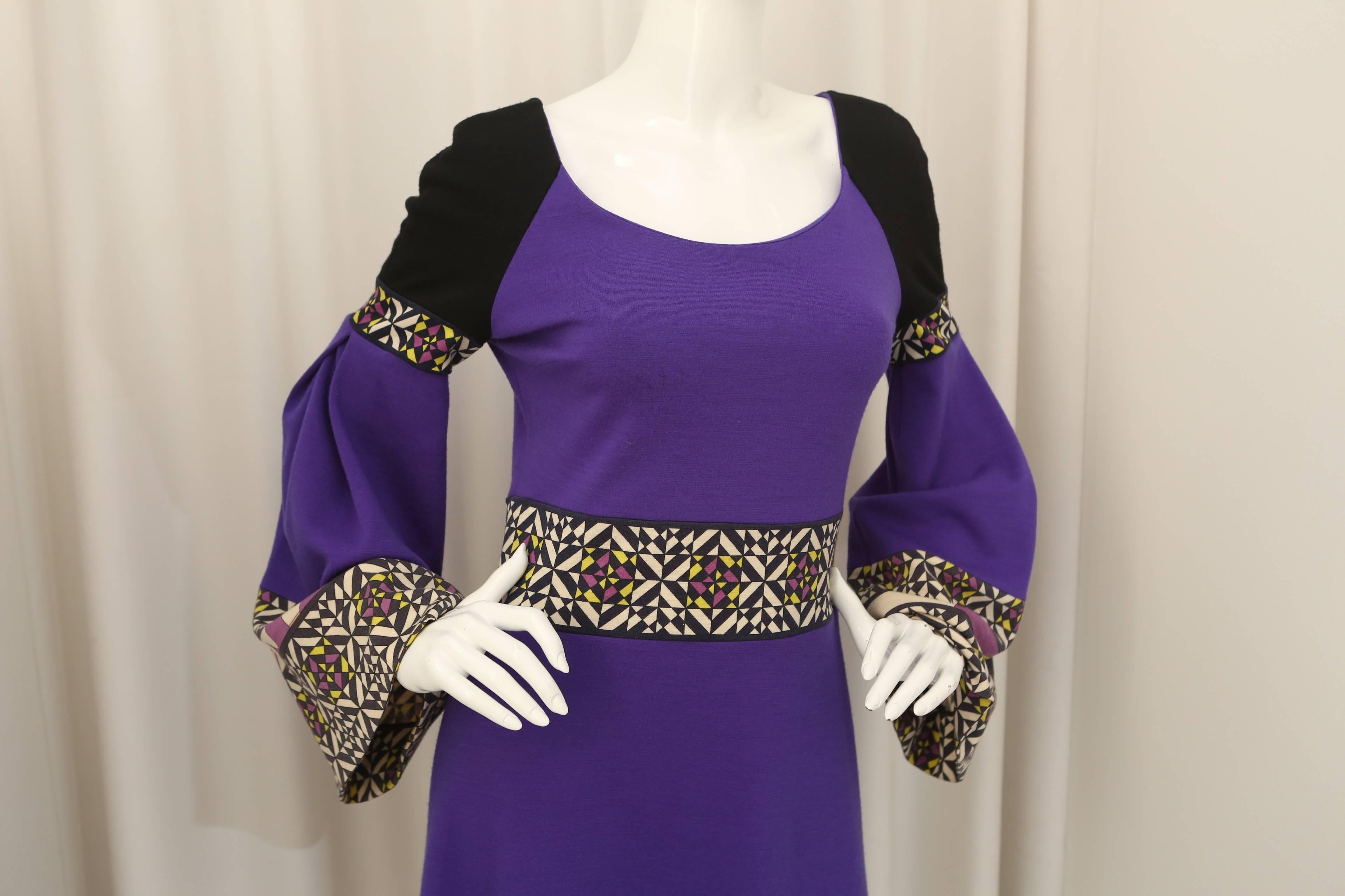 Emilio Pucci purple/multi colored dress with print on the waist, bottom and sleeves.  Boat style neck with bell sleeves.  