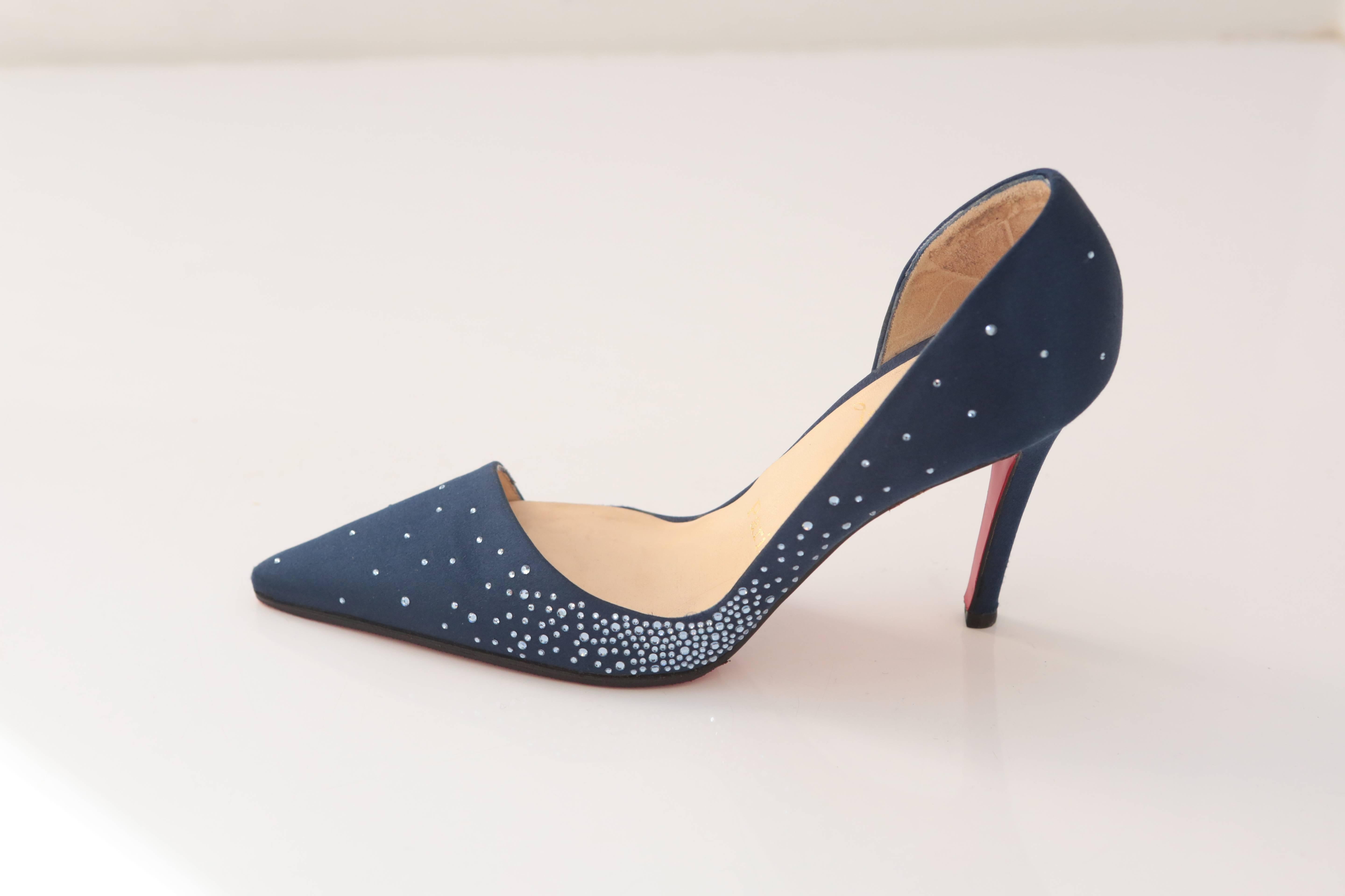 Something blue, something new or even something just for you! This Christian Louboutin D'orsay Pump in midnight blue satin with perfectly adorned crystals in all the right places will make you the belle of the ball.  SIZE 36