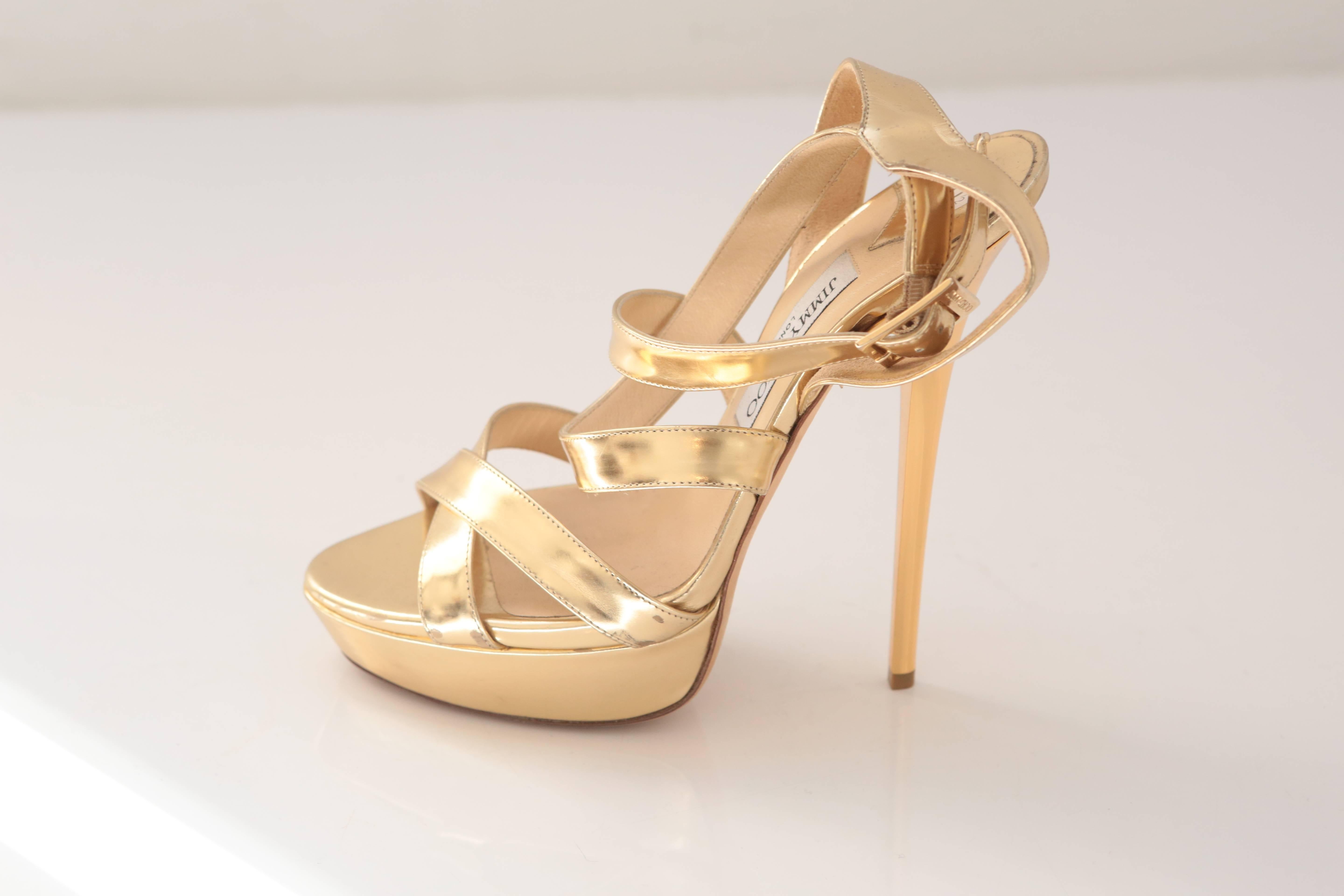 Must-have gold mirrored leather with crisscrossed straps over an open-toe. This platform sandal is a coveted piece among Manolo lovers!