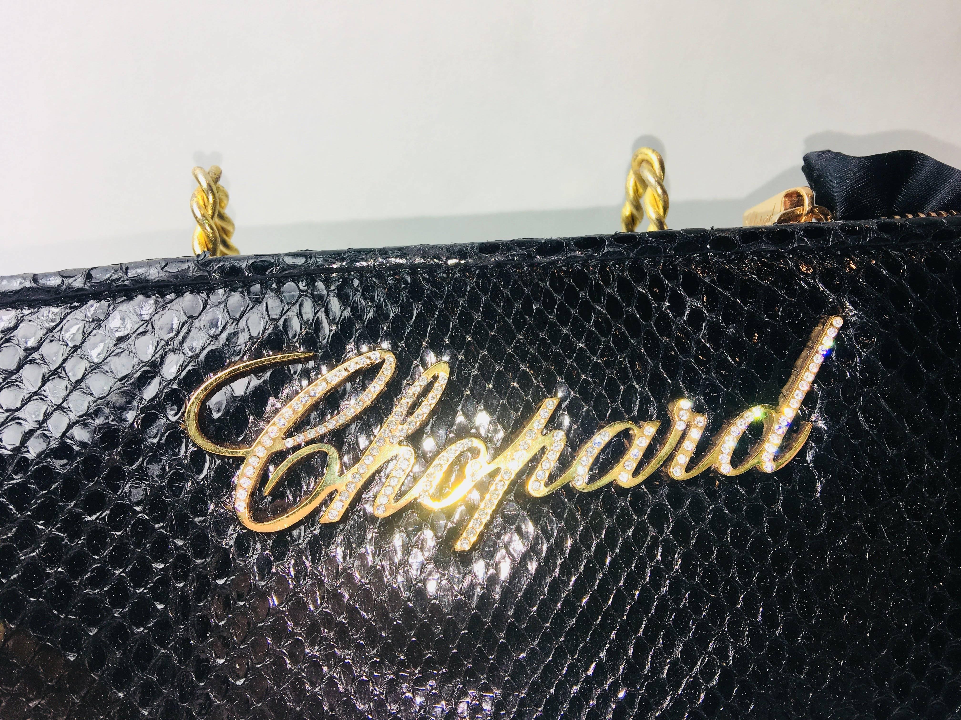 Chopard Black Python Clutch with Gold Bracelet Wristlet and Pave Crystal Detail. 