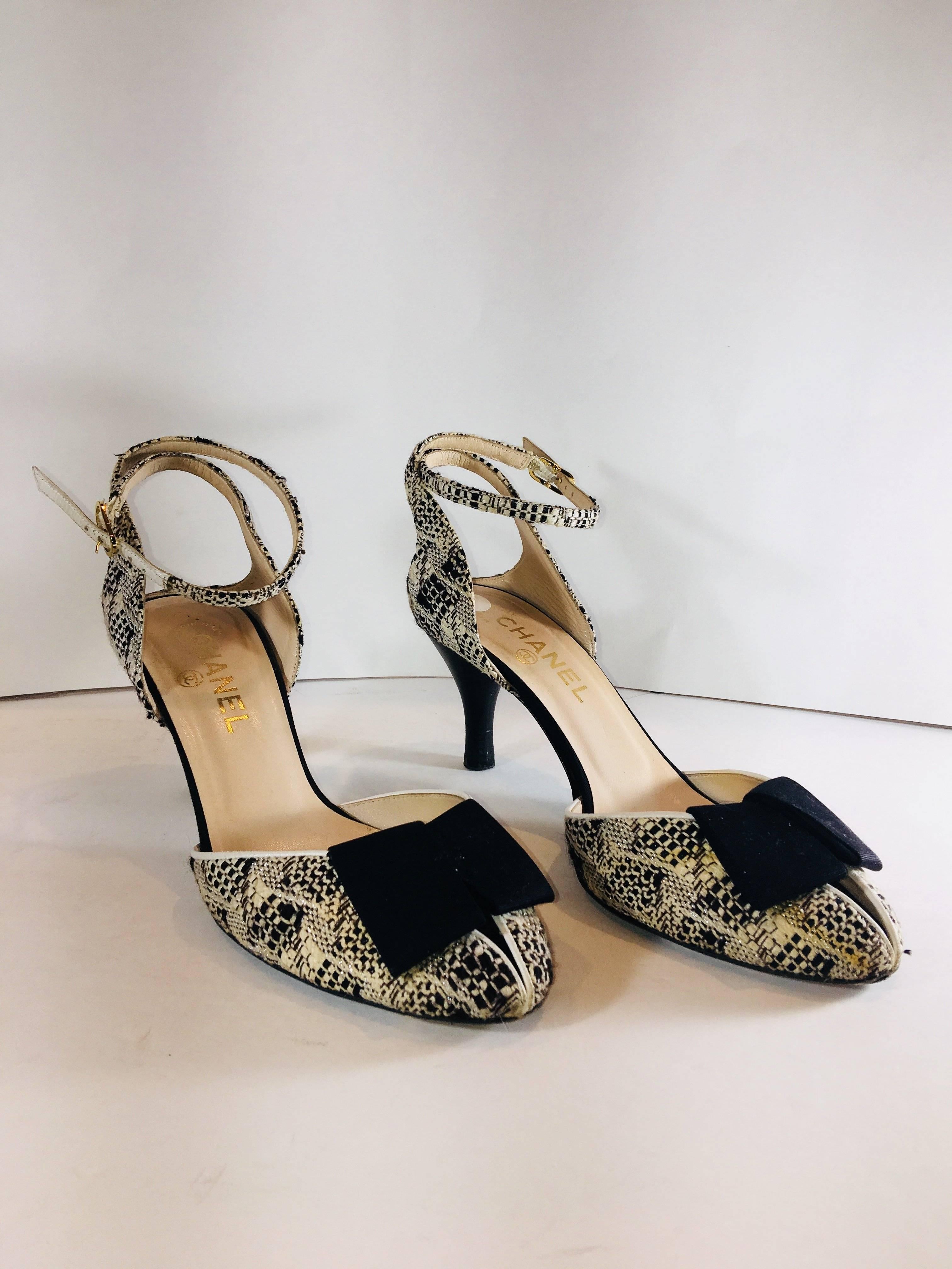 Chanel Round Toe with Ribbon Bow Accents at Toe and Ankle Strap in Black and White and Metallic Tweed Pattern and Gold Hardware. 