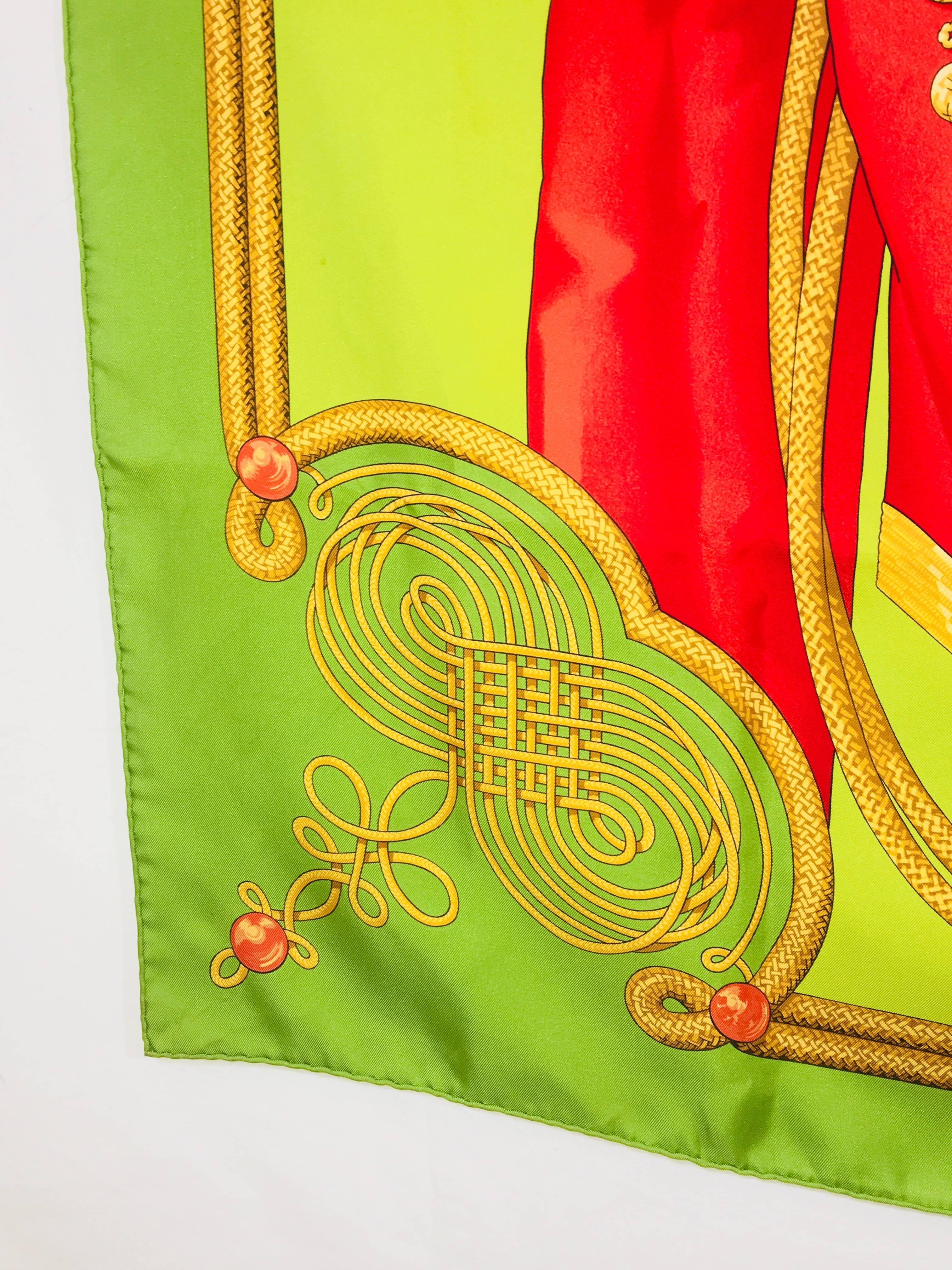 Brandebourg Hermès Scarf with Box. Yellow and Green Silk. The motif is inspired by drawings of military uniforms in the Émile Hermès collection