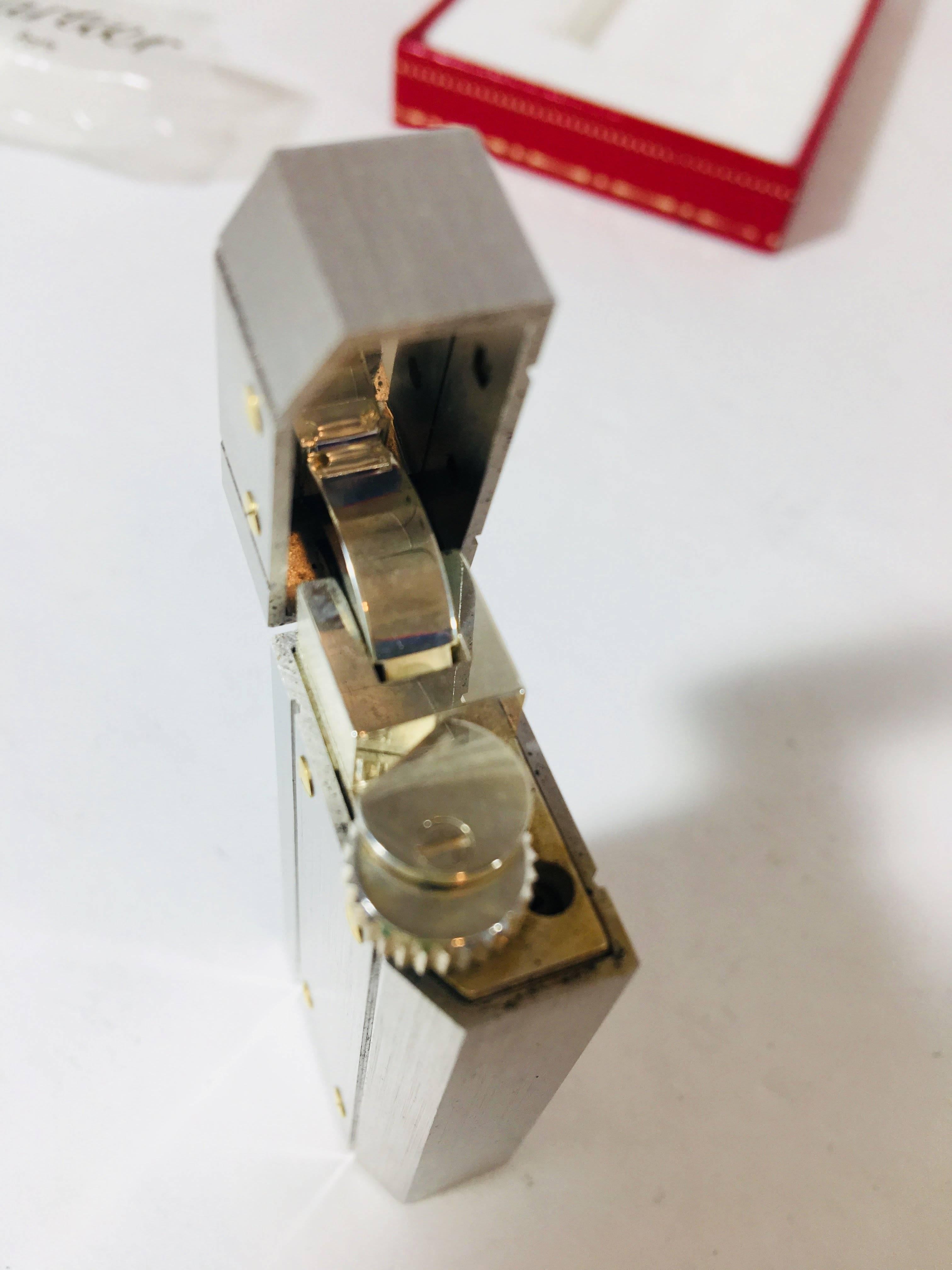 Cartier Silver Lighter with Gold Screws.