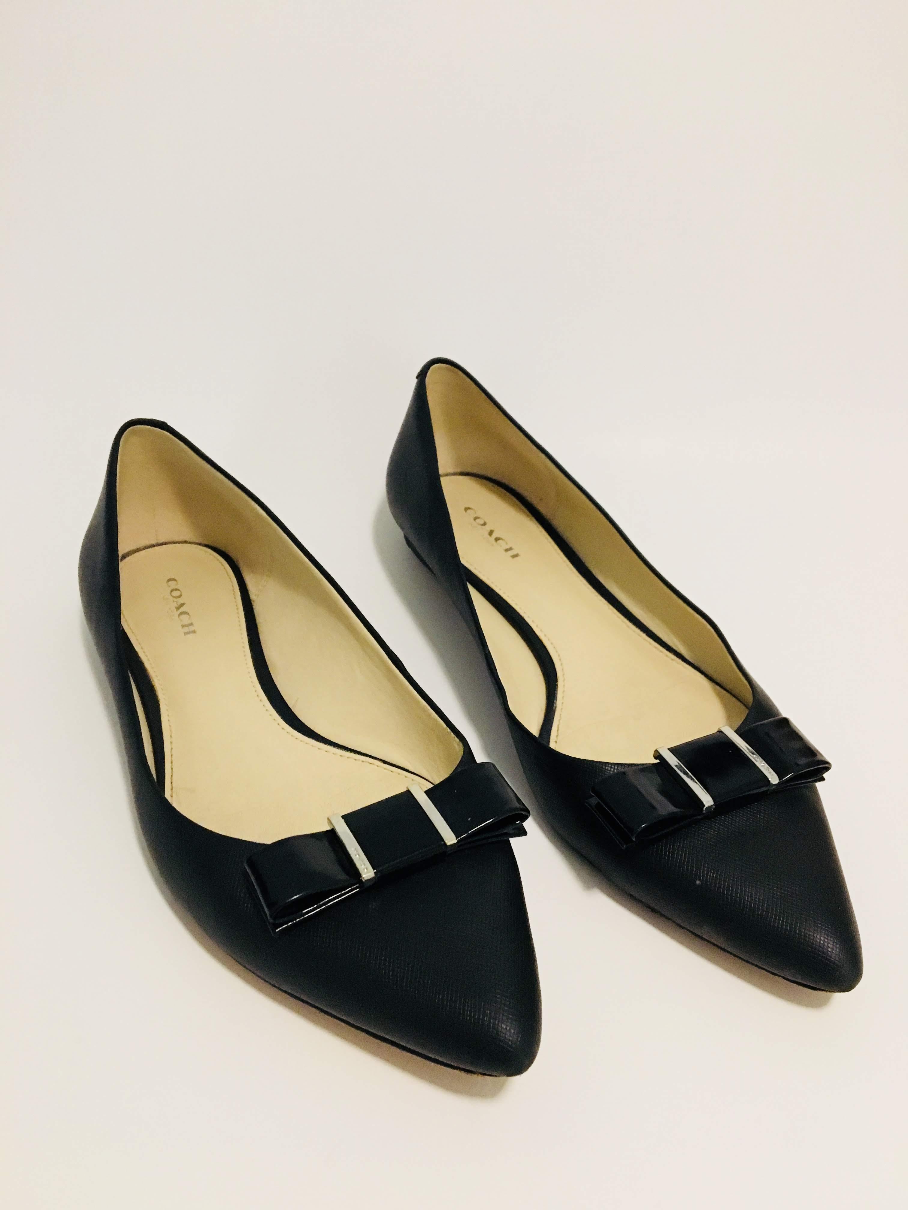 Coach Black Crosshatch Leather Flats in US Size 7.5 with Pointed Toe and Patent Leather Bow at Toe.