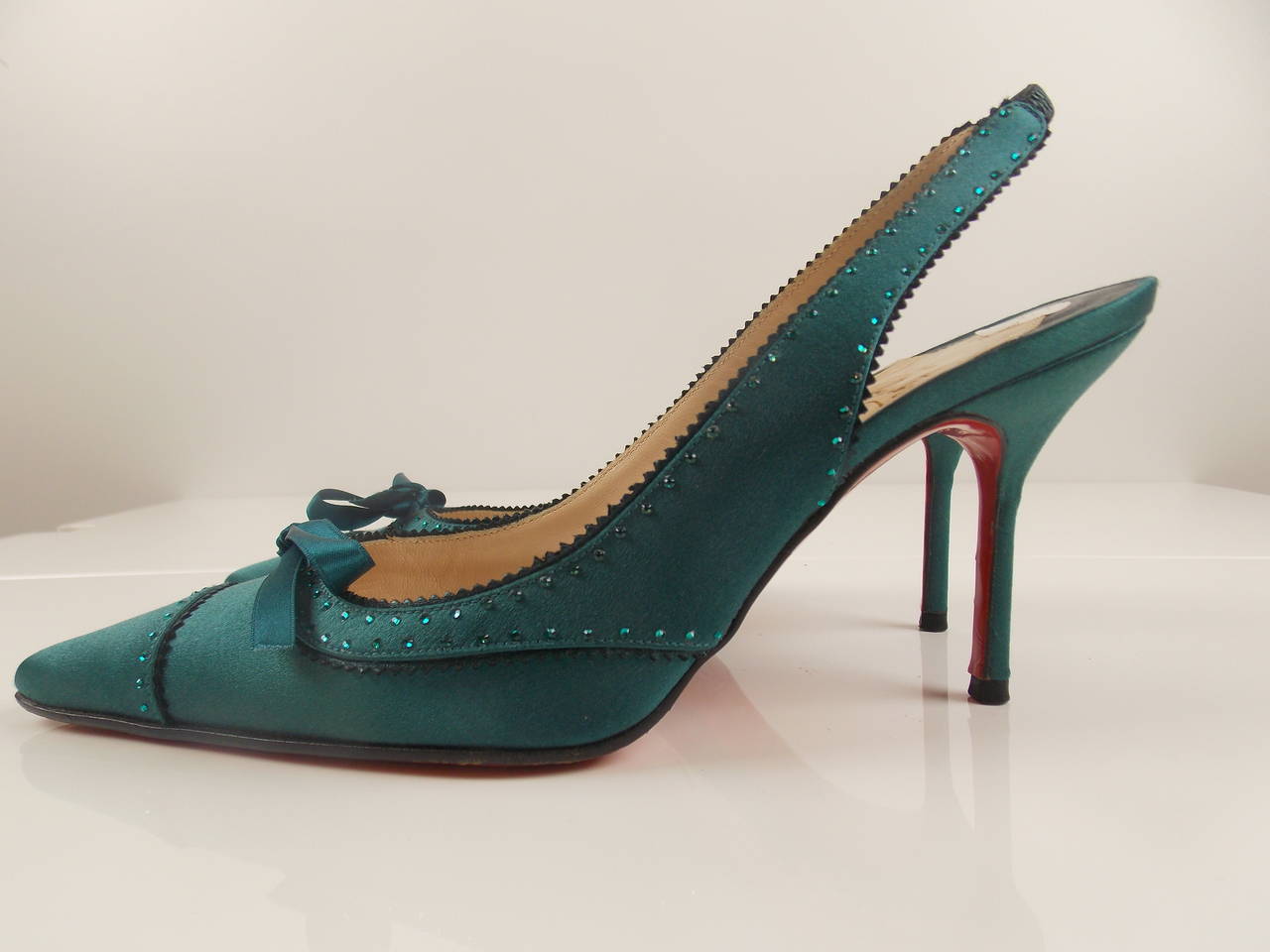 Teal, Satin, Sling Back Pumps, with rhinestone detail, and silk bow detail;
size 36.5, kitten heel