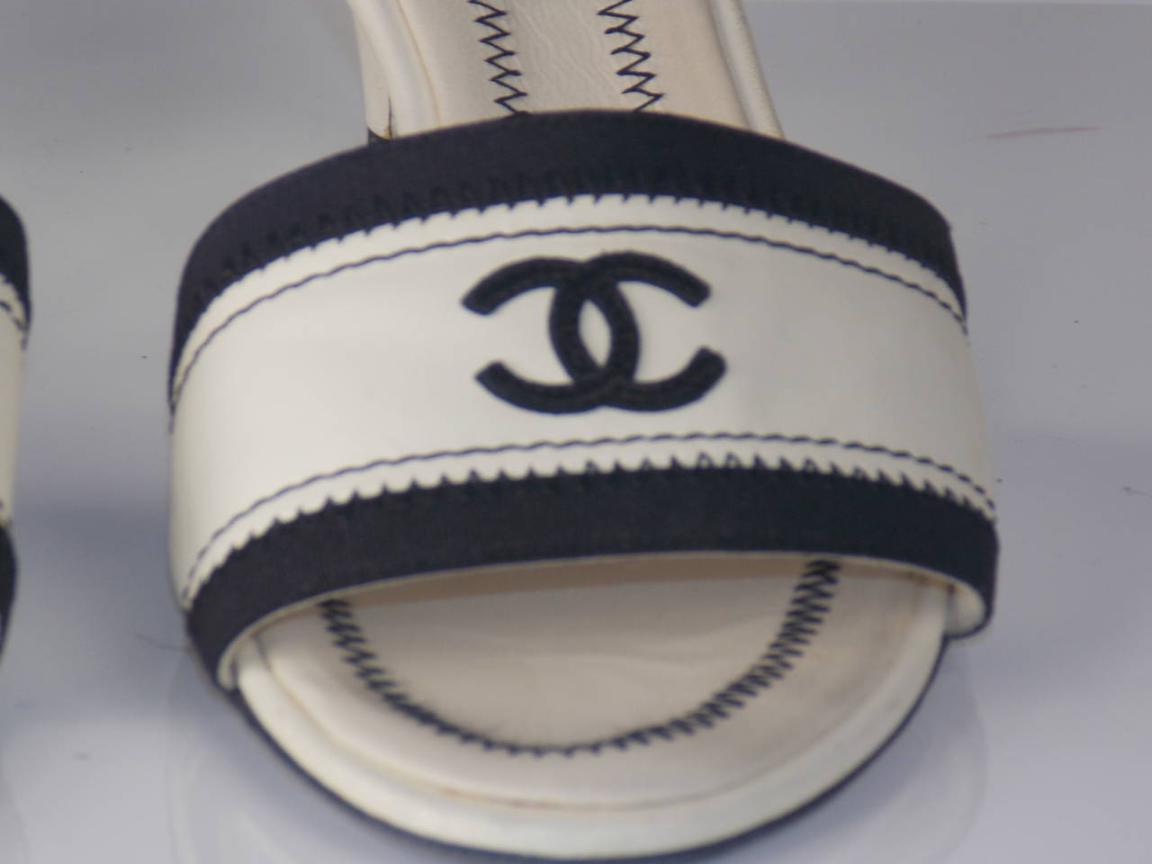 Chanel super chic mule, cream leather with kitten heel and stitched black CC logo on strap. The little sole on the heel looks new and the stitching is lovely.