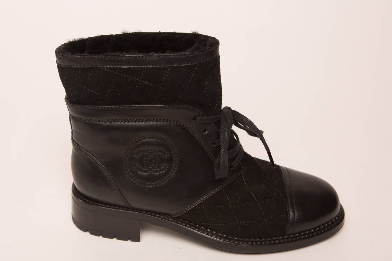 Chanel black suede and leather lace up ankle boot.