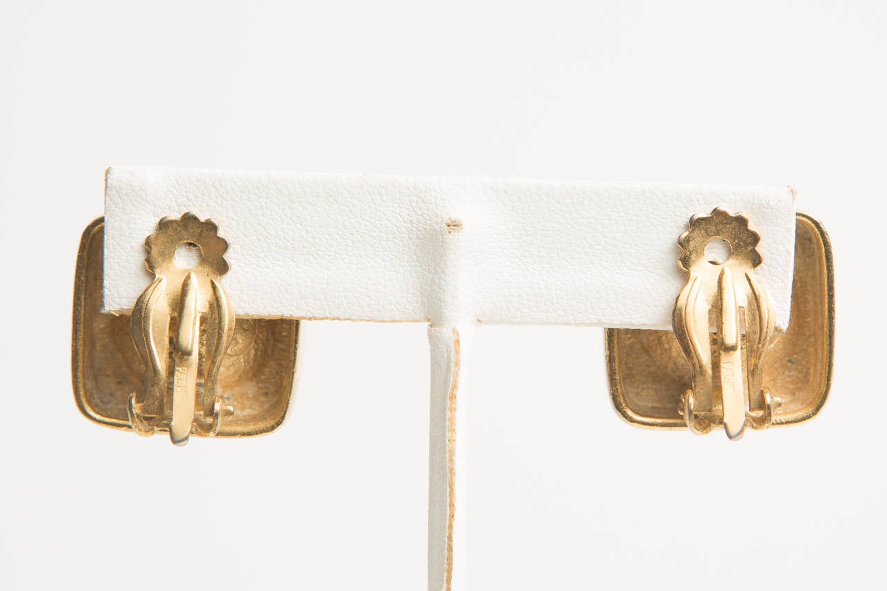 Lanvin gold cube shape clip earrings with square crystal.