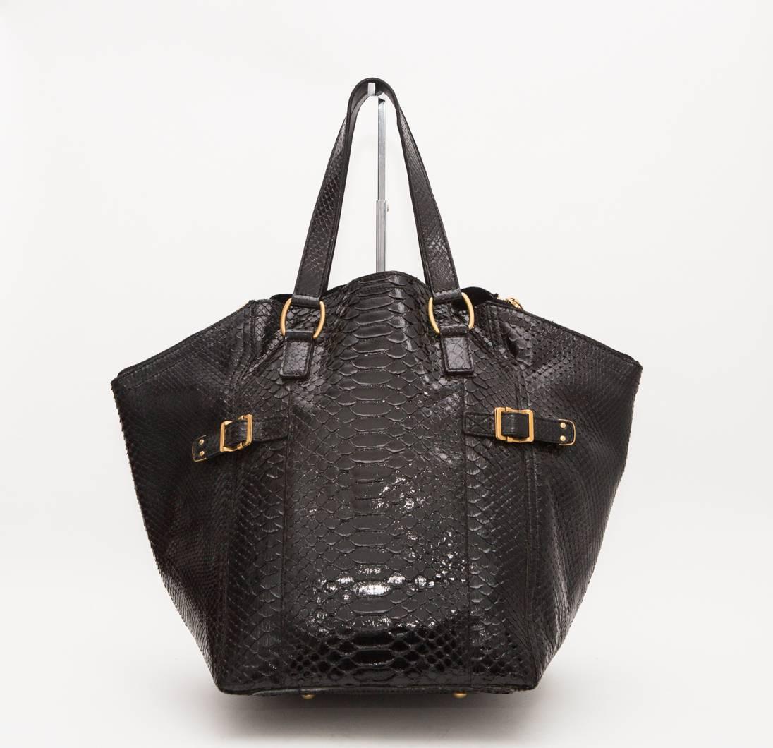 Black python leather tote with gold hardware. 
Card of authenticity included.