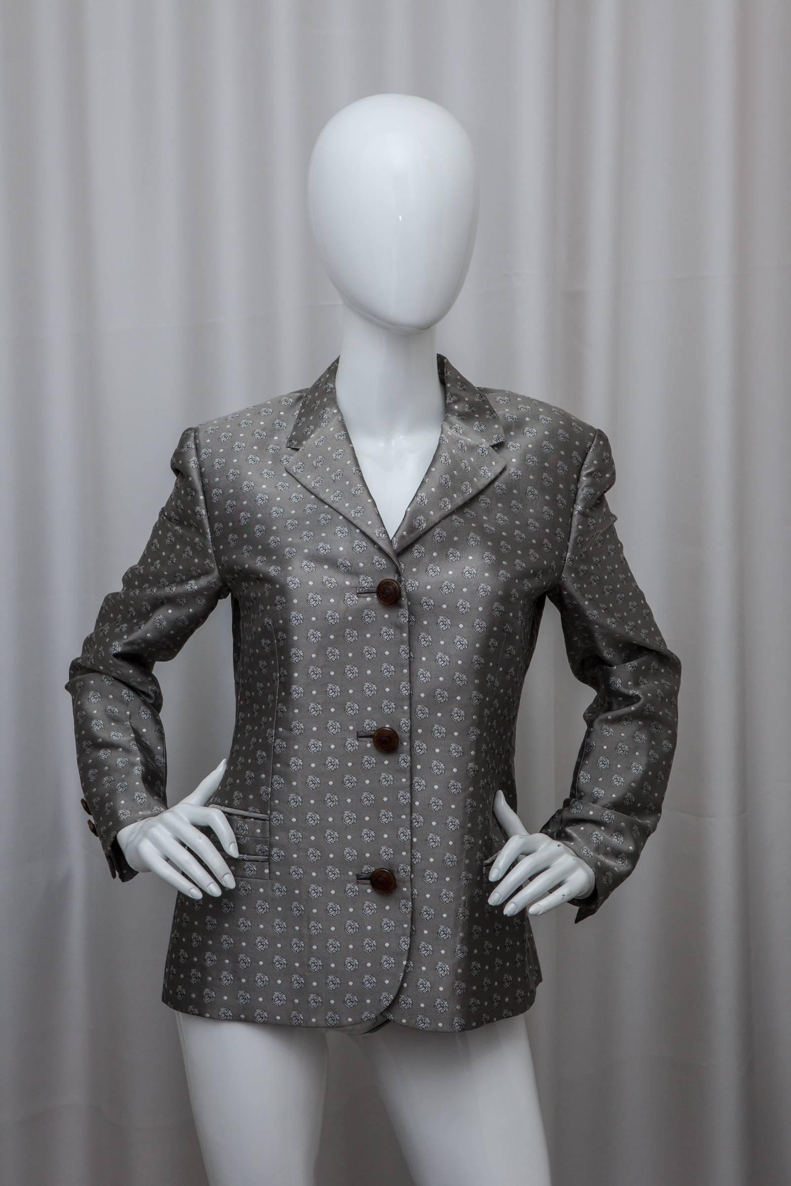 Silver single breasted blazer with signature Versace pattern, brown buttons and front pockets.