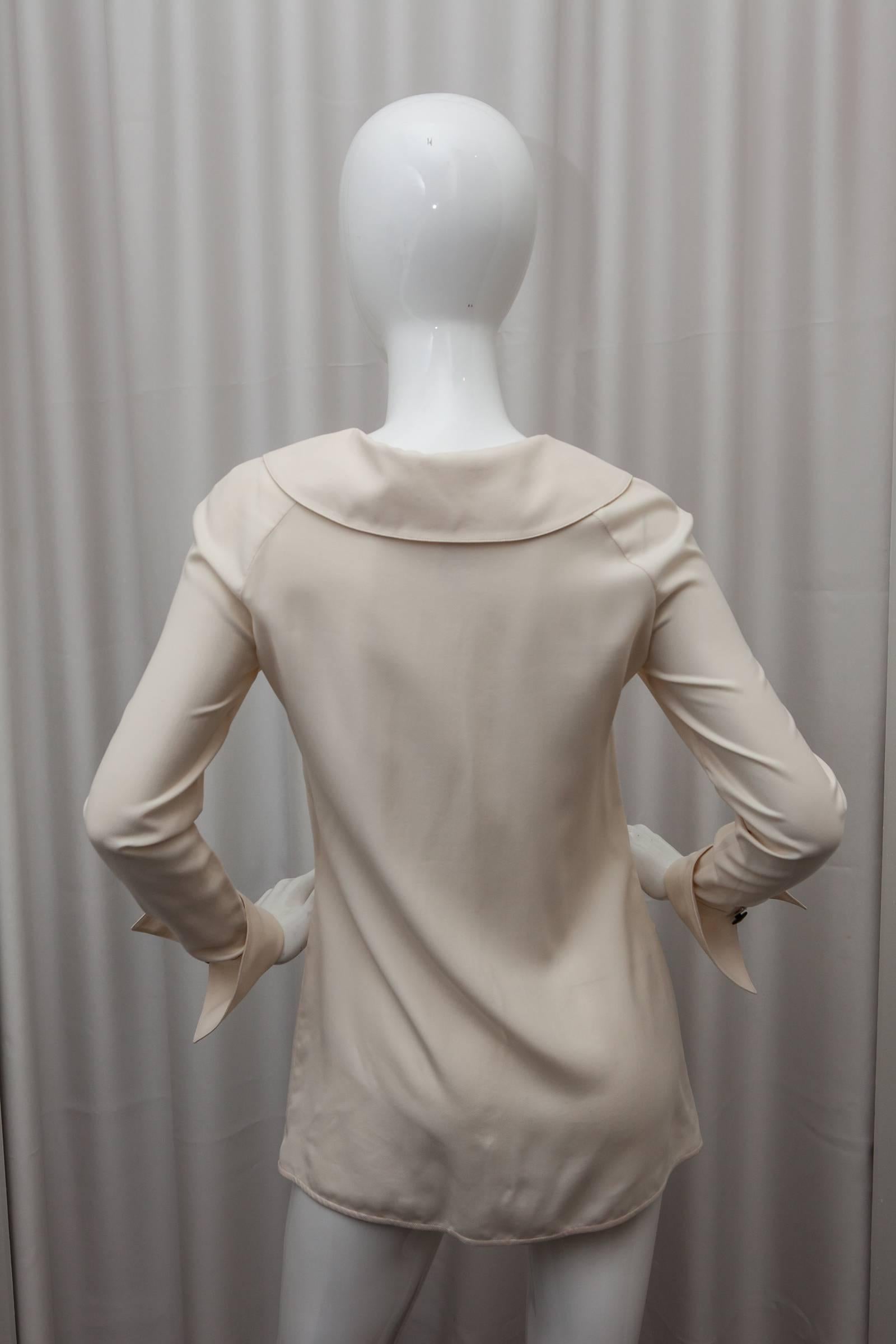 Valentino Boutique cream silk blouse with collar detail and two front pockets.