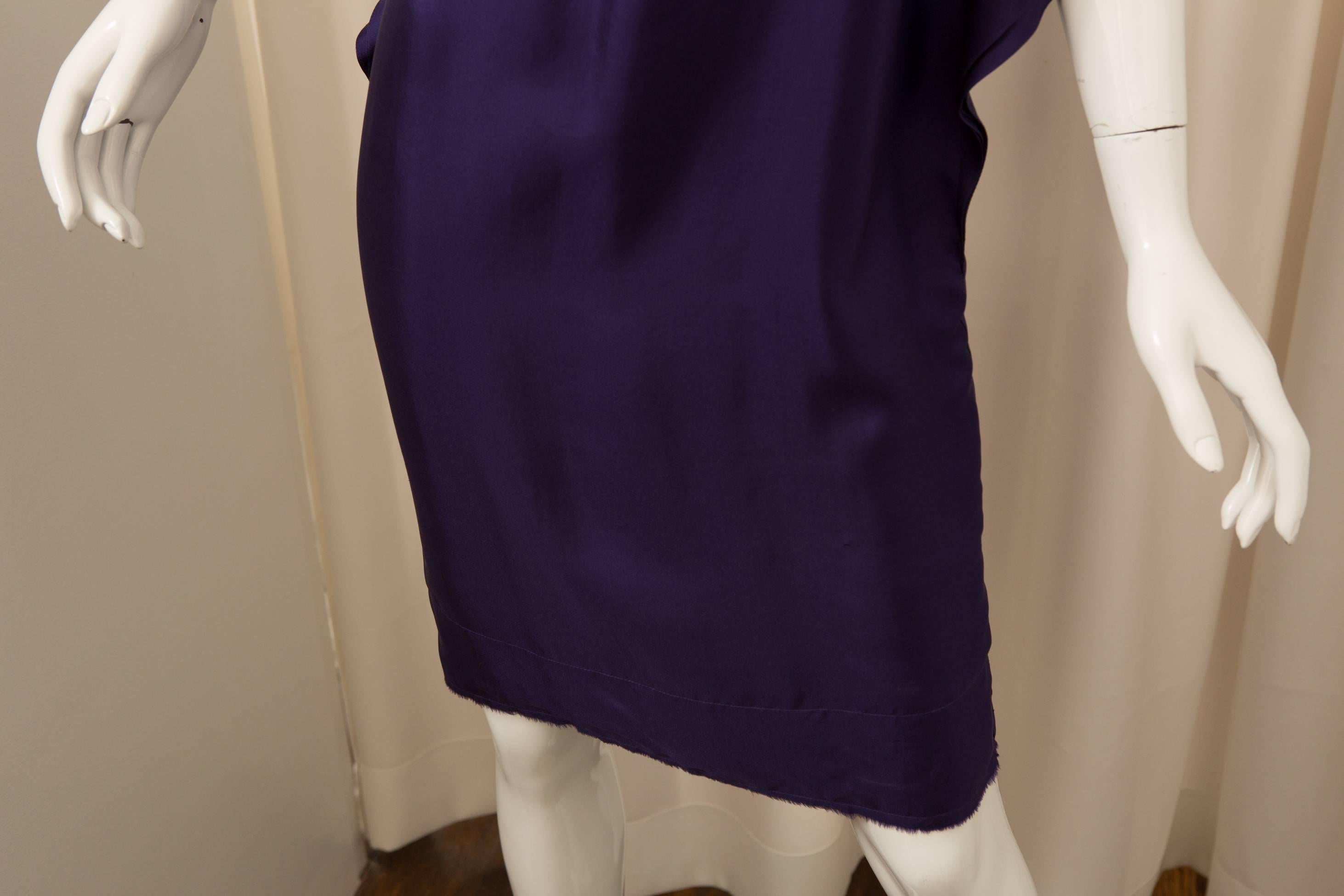 Silk purple cap sleeve dress with ruffles.