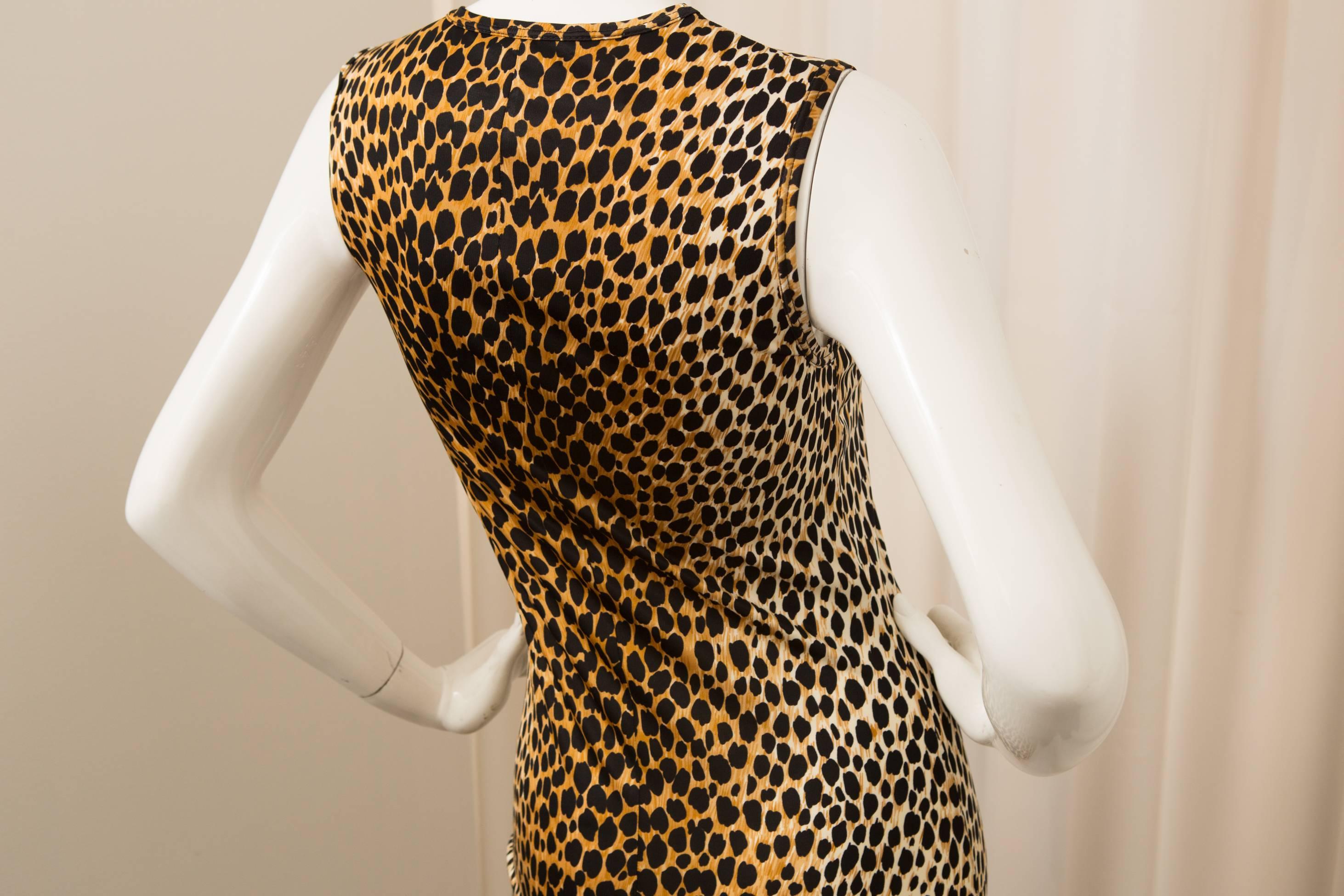 Sleeveless silk, leopard print dress with flare bottom detail. 