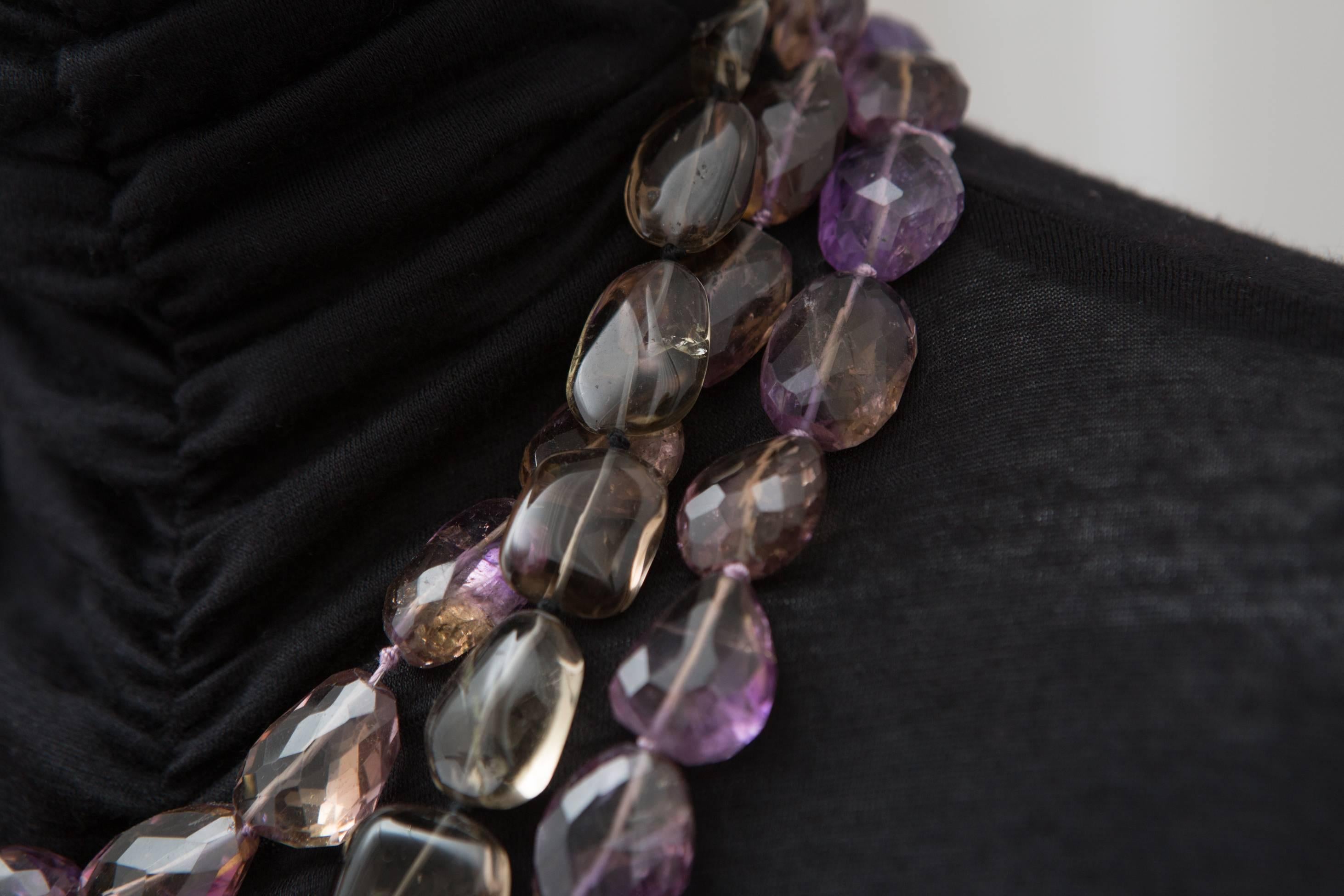 Multi strand amethyst and beads necklace with detachable brooch.