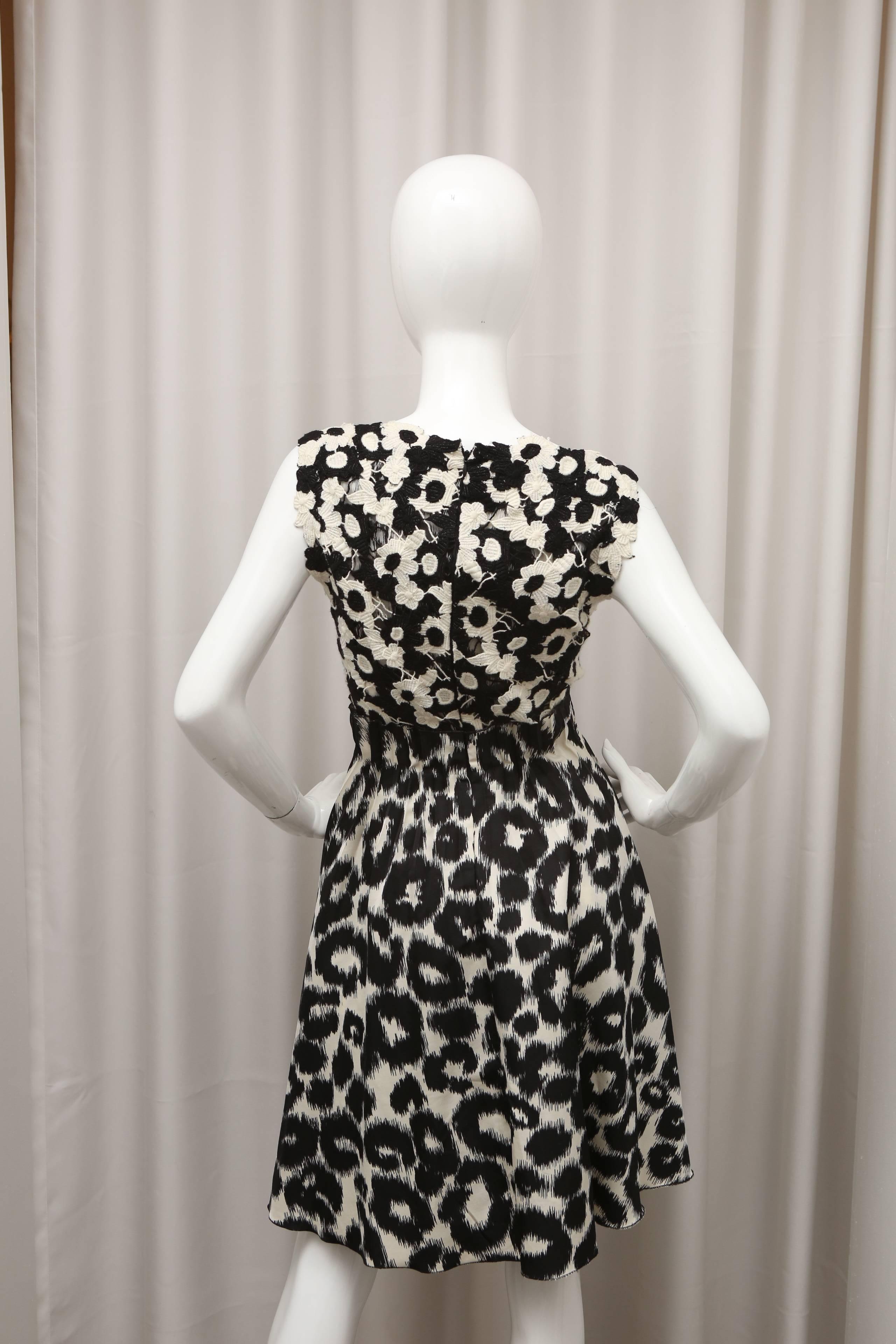 Black and white floral patterned top and leopard print bottom dress.