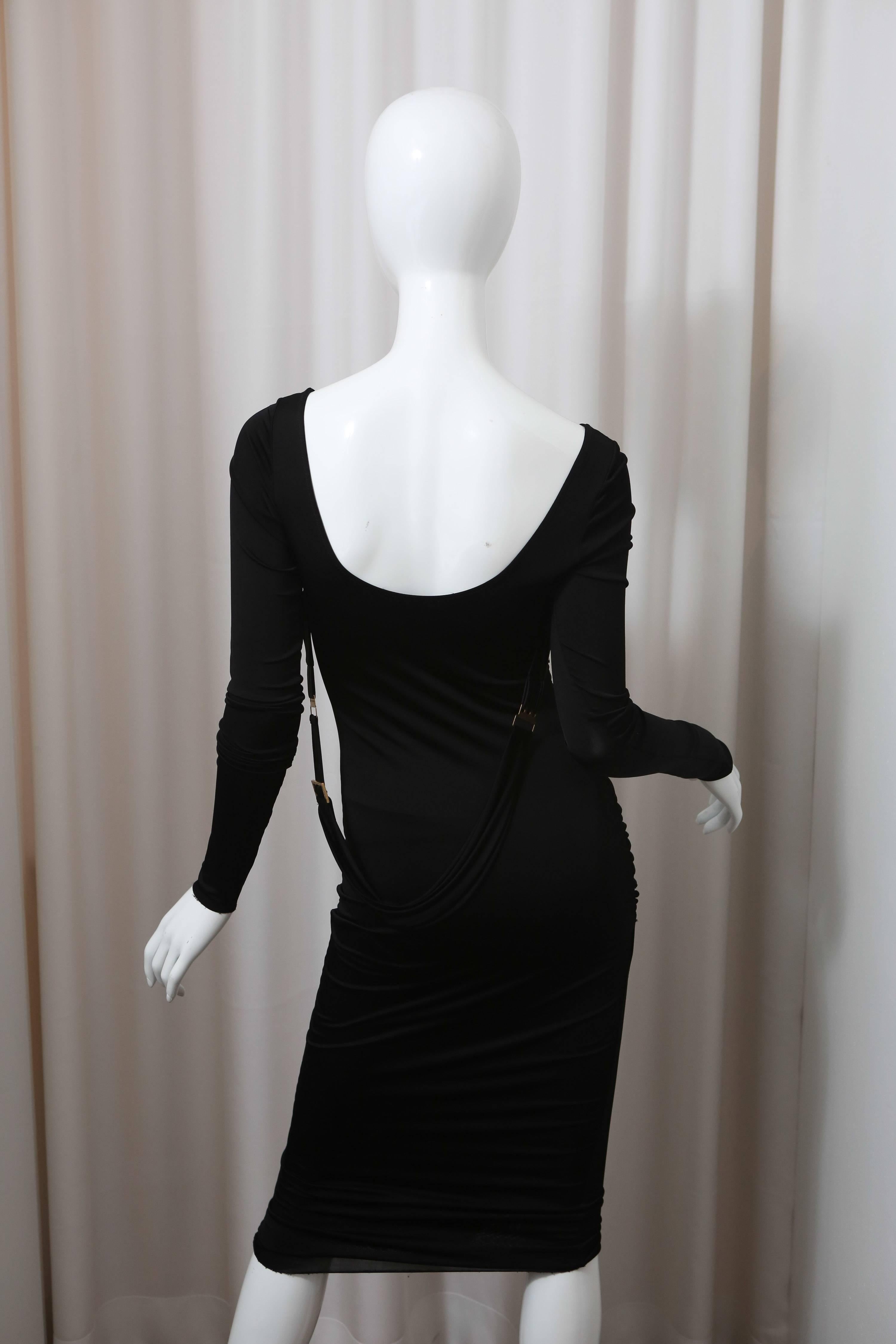 Black faux wrap dress with hanging belt detail.