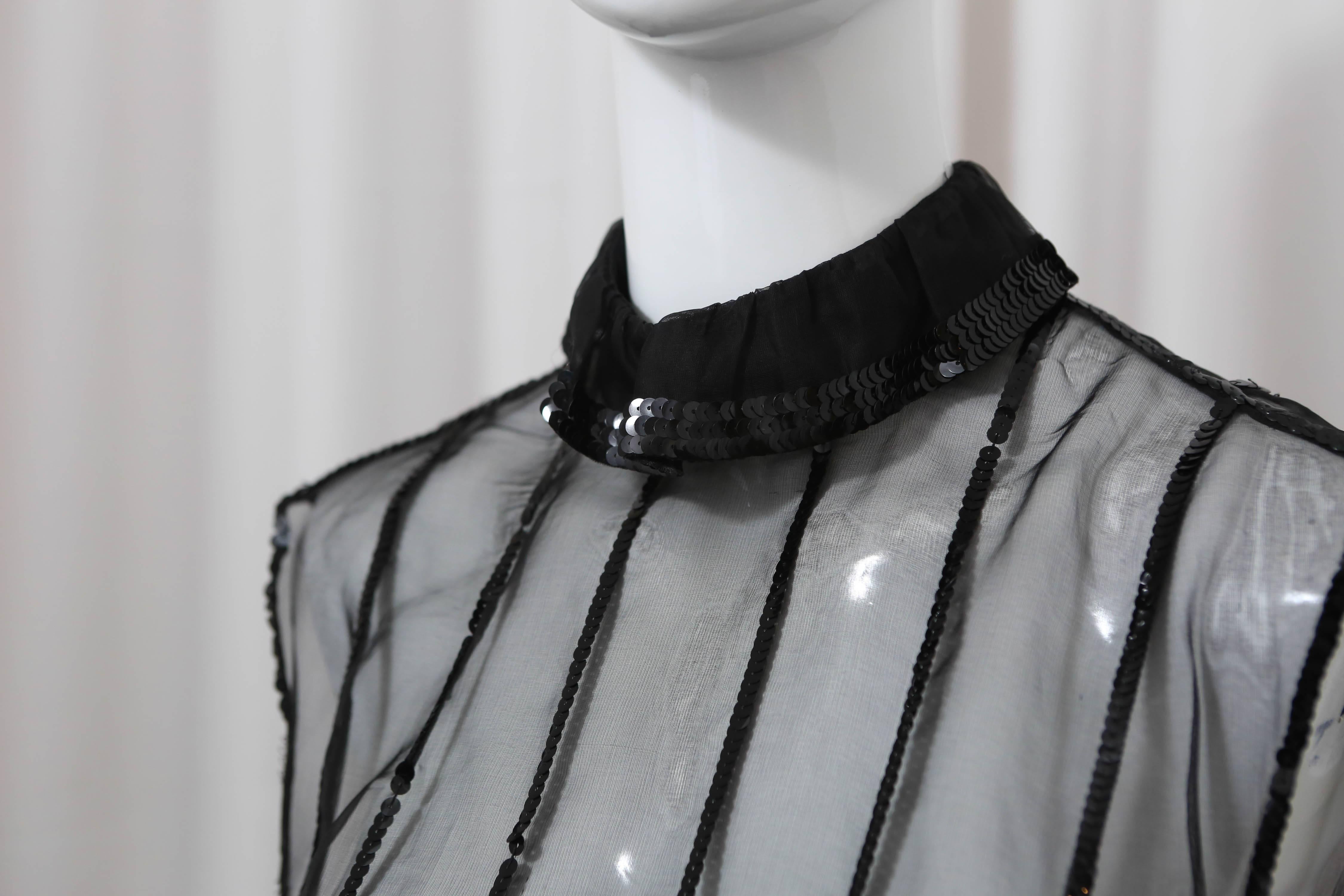Black silk sheer top with black sequins detail.