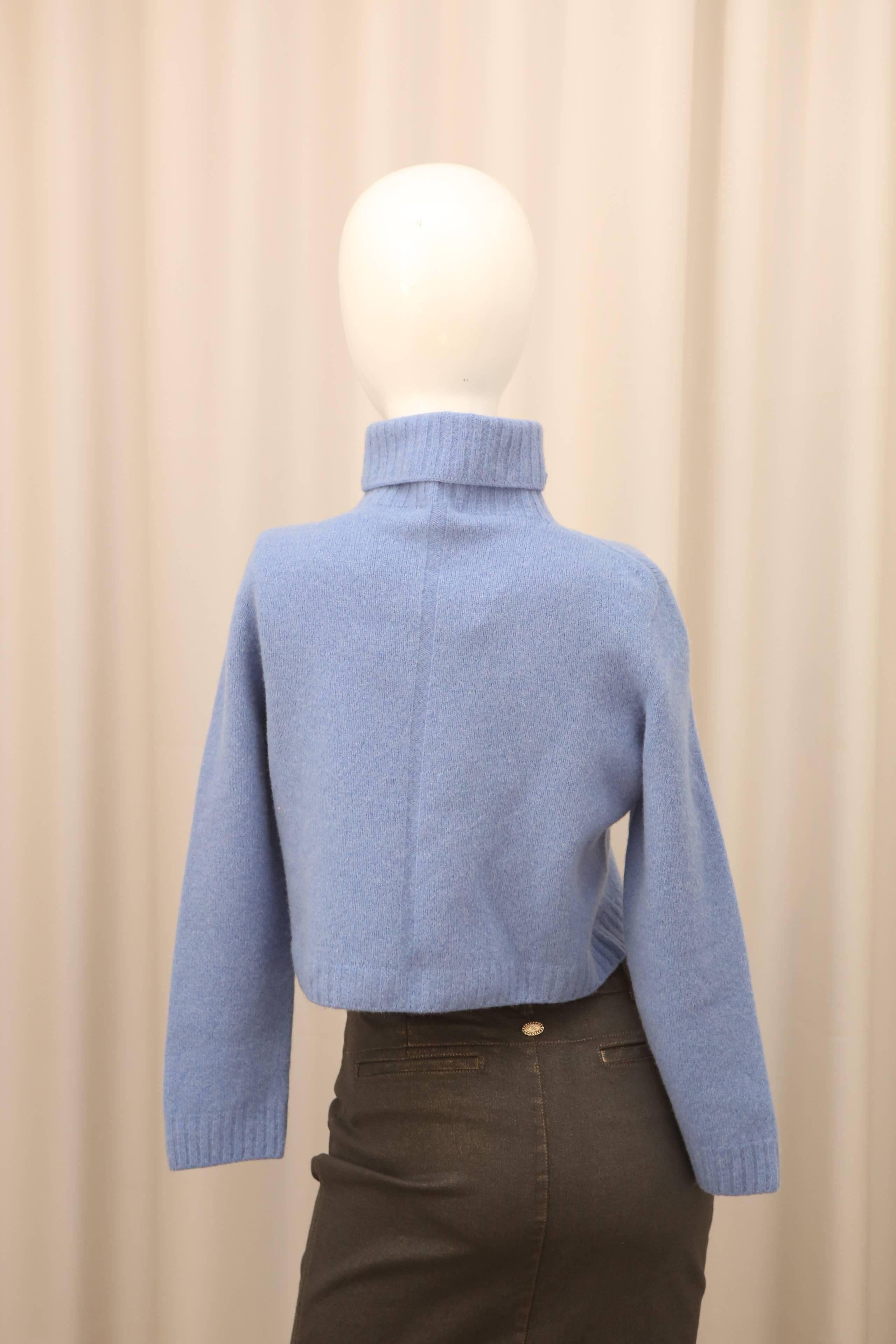 The Row longsleeve cropped turtleneck sweater in Chambray.  Ribbed along neck.  New W/ Tags.  

Sleeve Length: 21
