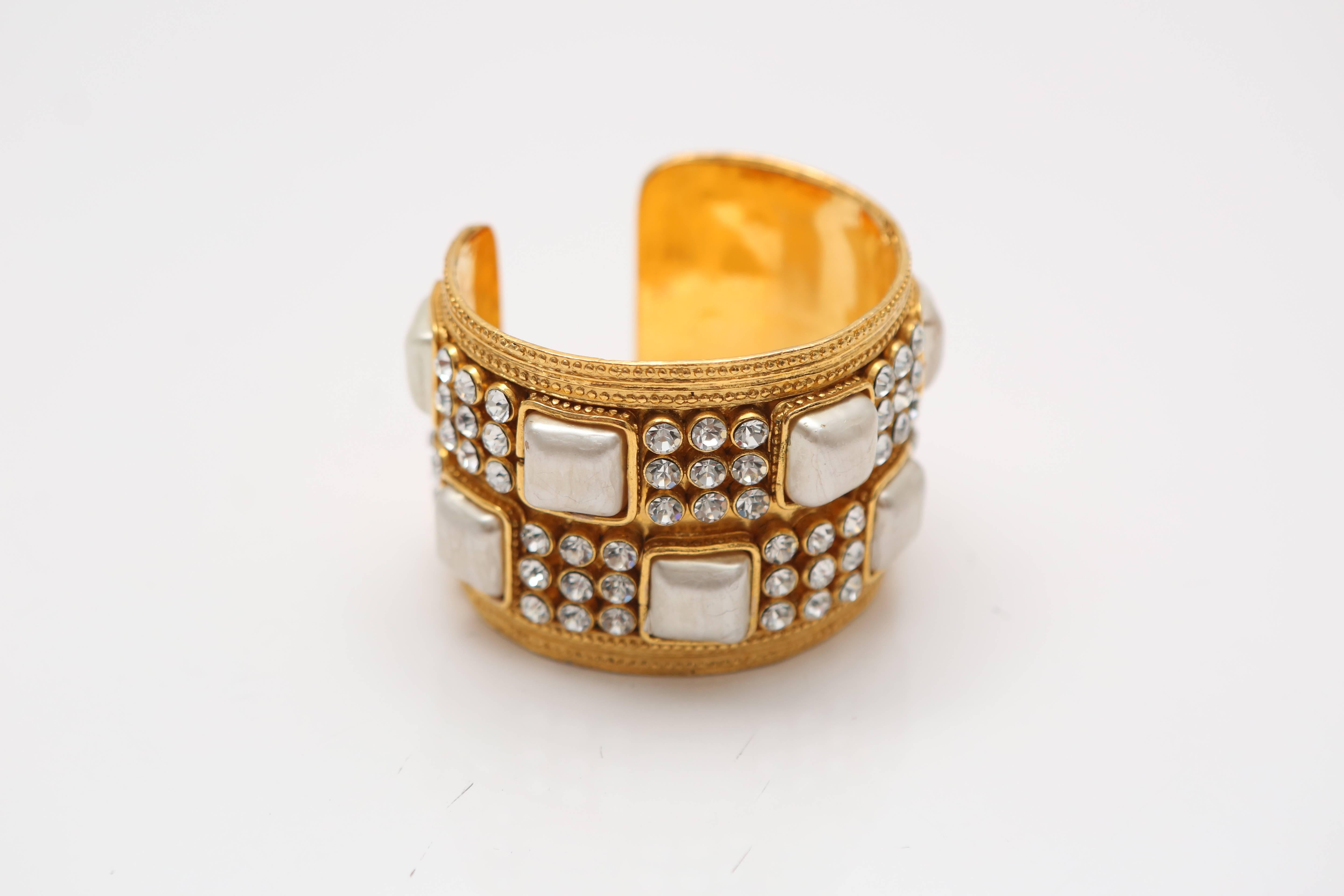 Chanel gold plated cuff with ivory stones and rhinestone detail.