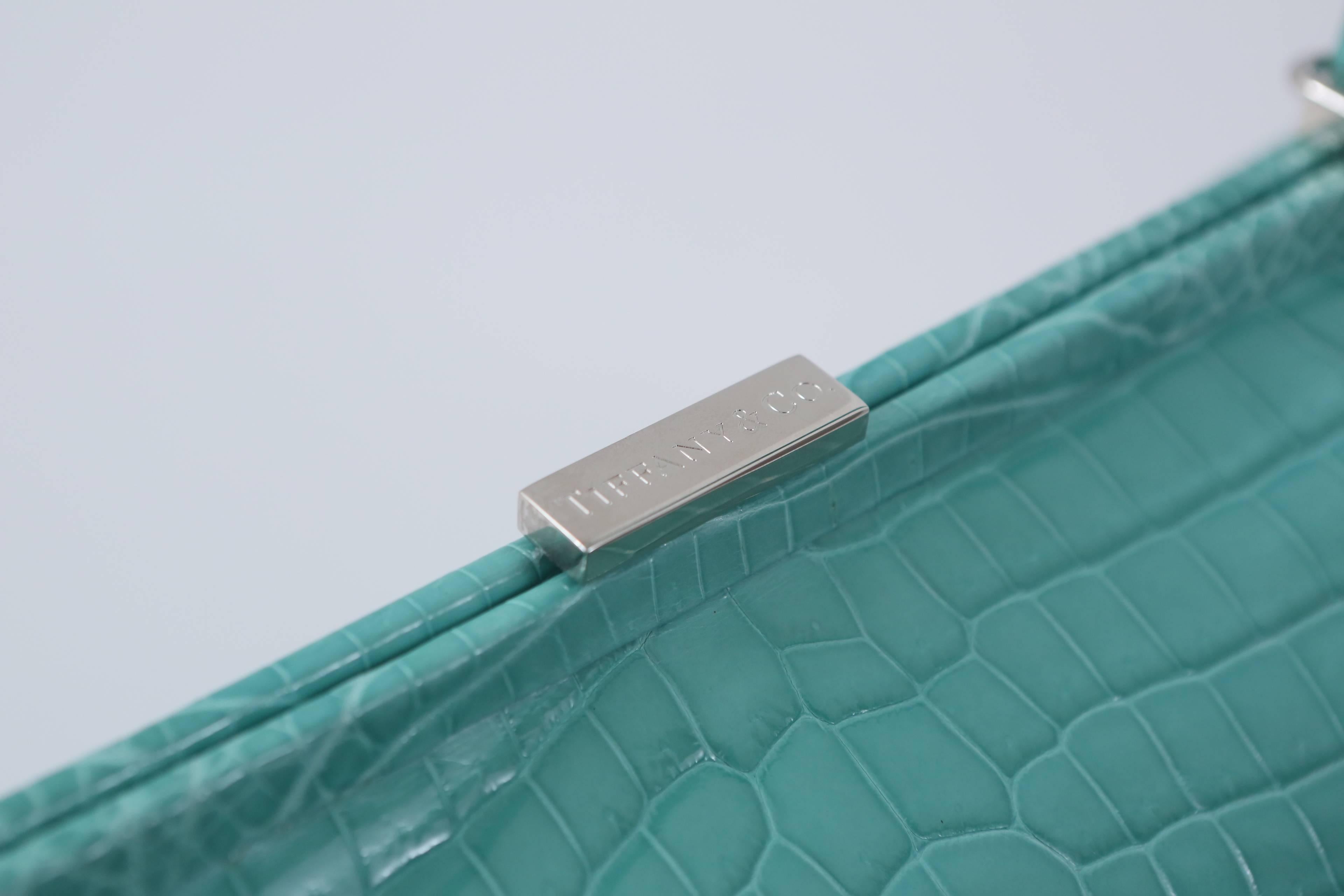 Tiffany & Co. "Laurelton" crocodile handbag in Tiffany Blue with single top handle, silver hardware and front pocket.  

Comes with original box & shopping bag.
