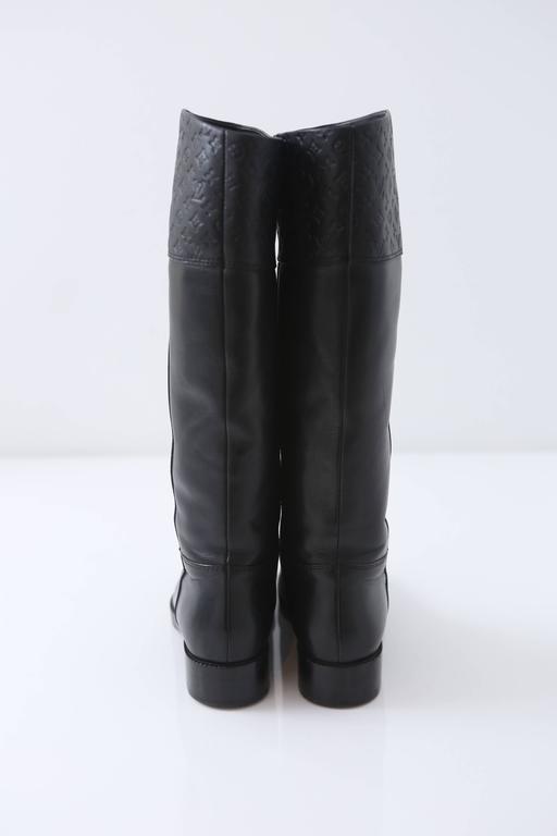 Louis Vuitton Black Leather Riding Boots W/ Embossed Monogram For Sale at 1stdibs