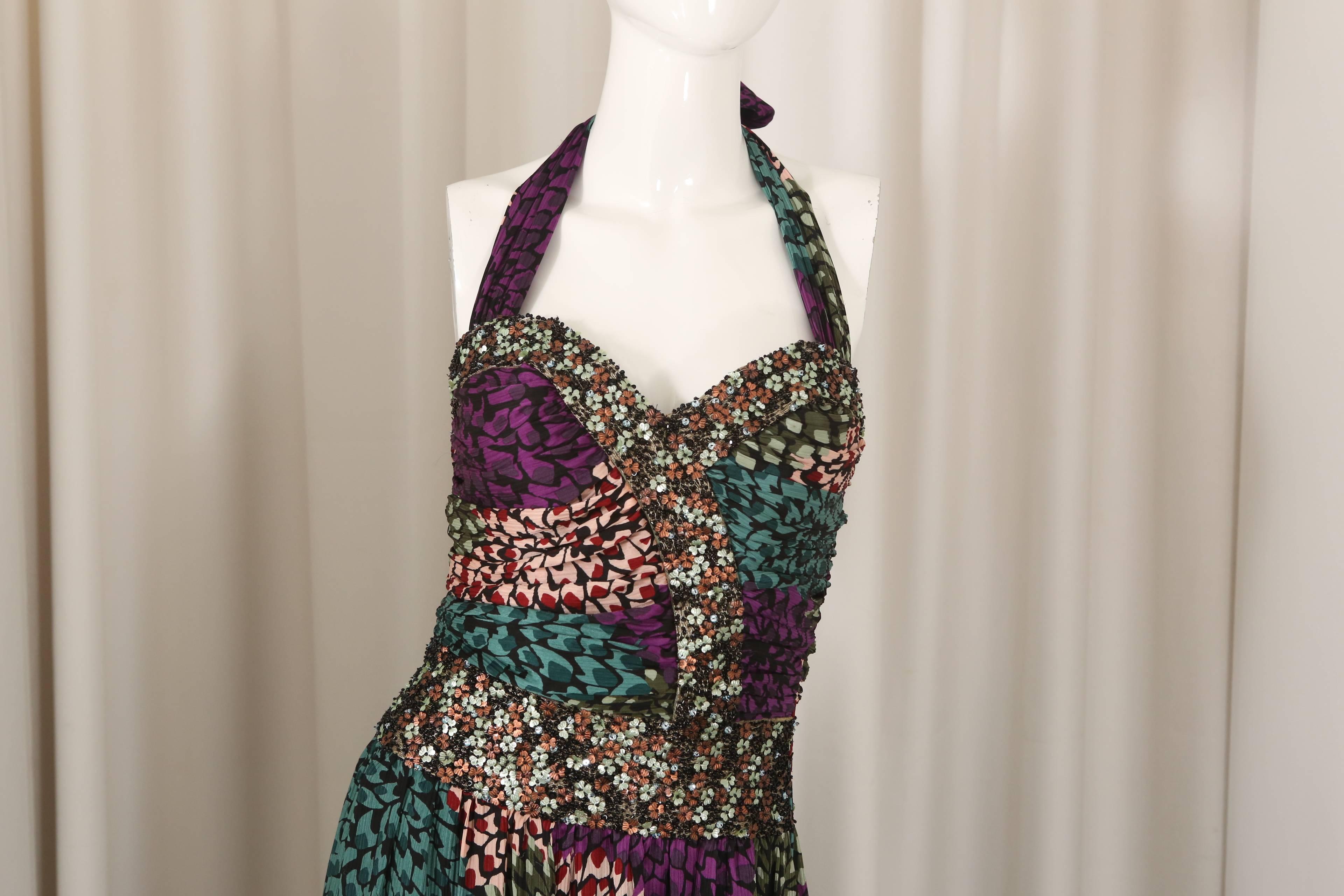 Missoni purple/green printed halter gown with floral embellishments at wasit & bodice.  