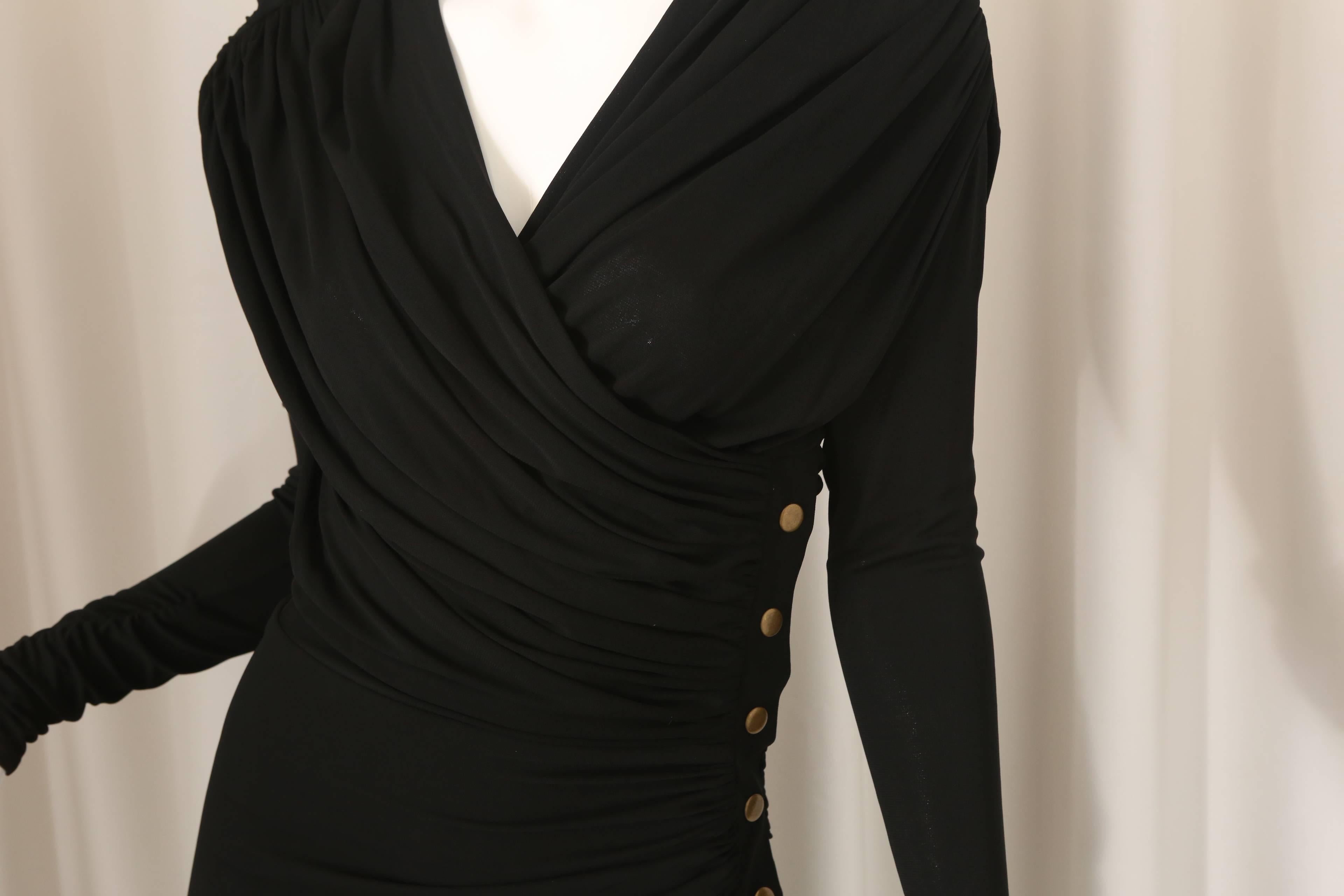 Derek Lam black long sleeve dress with brass snap detail, faux wrap and ruching.  Zippers on shoulders.  