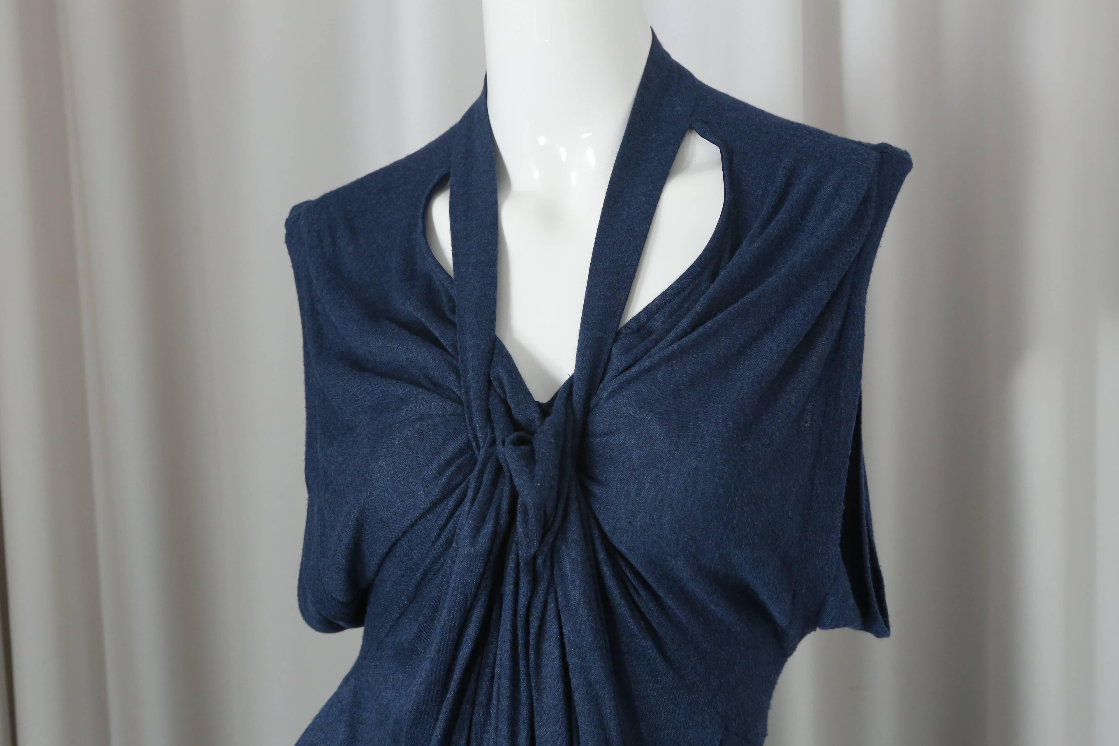 YSL blue sleeveless dress with front knot, exposure at neckline and back scallop detail.